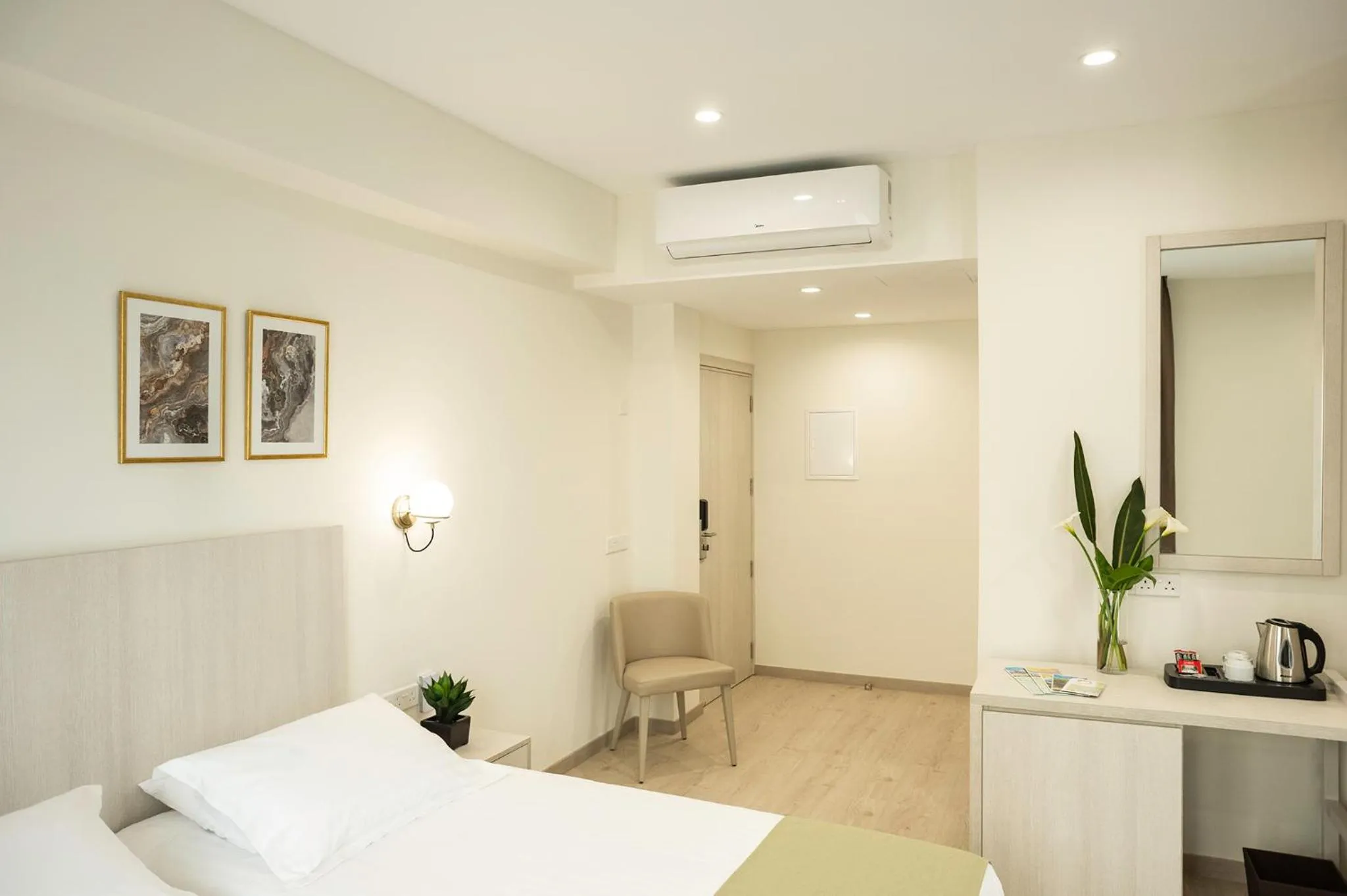 Bed in Roseum Boutique Hotel