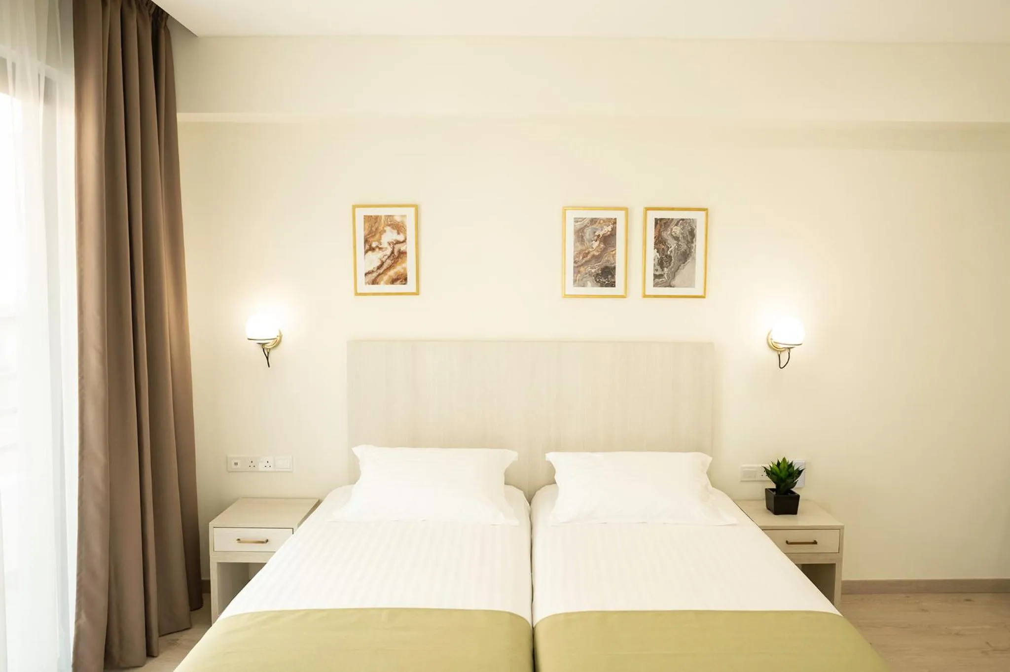 Bed in Roseum Boutique Hotel