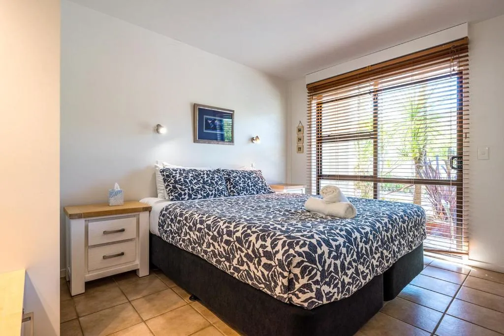 Bed in Onetangi Beach Apartments