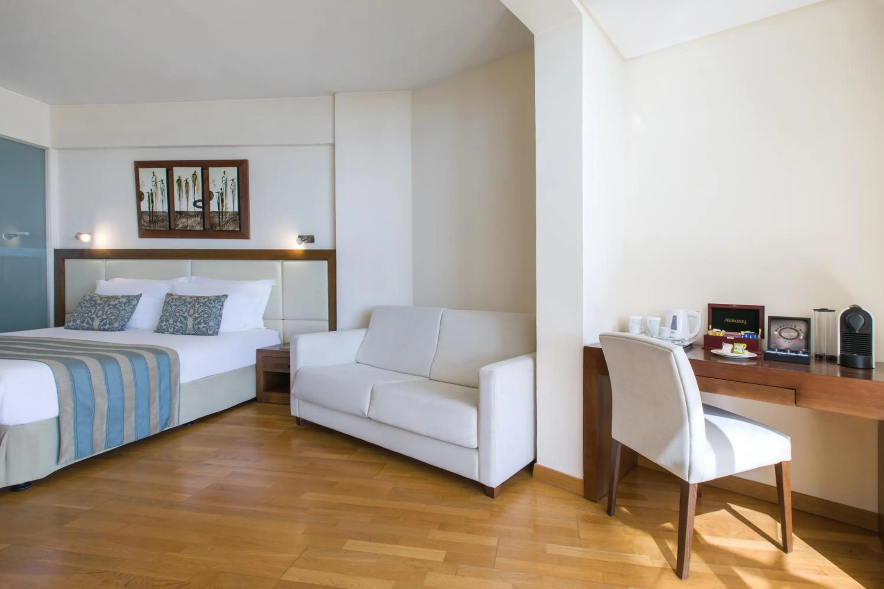 Living room, Bed in Golden Bay Beach Hotel