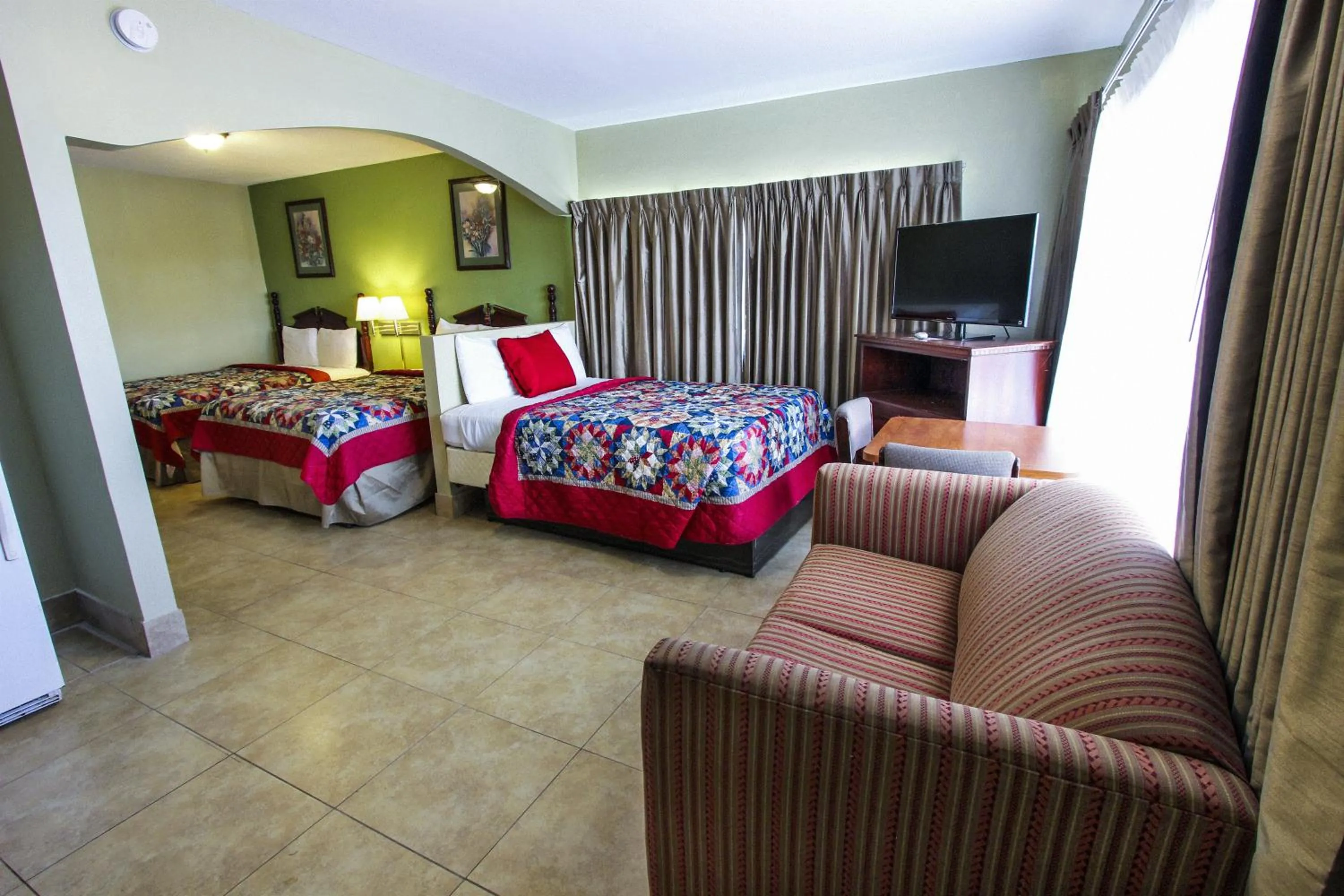 Seating area, Bed in Oceans Beach Resort & Suites