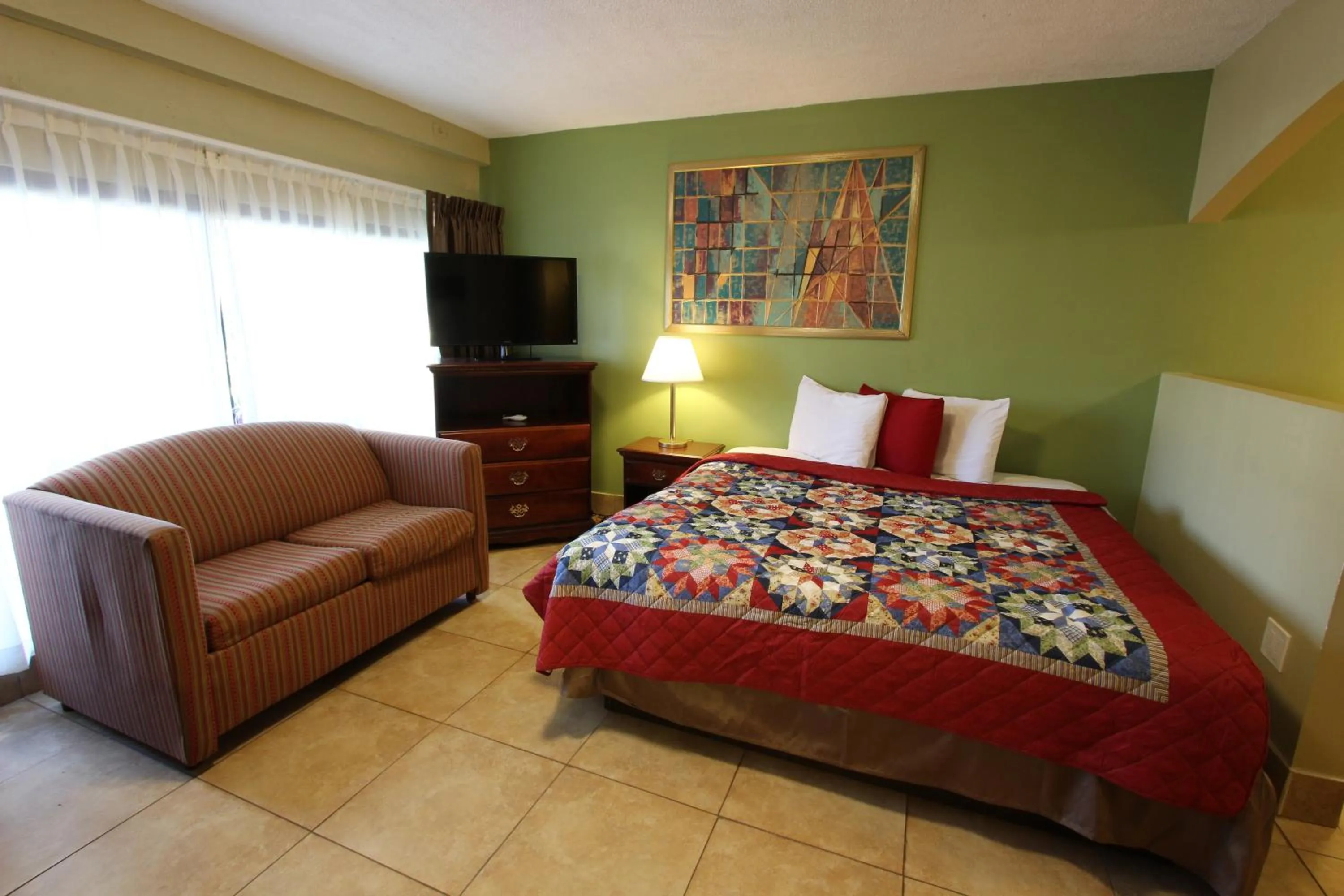 Bedroom, Bed in Oceans Beach Resort & Suites