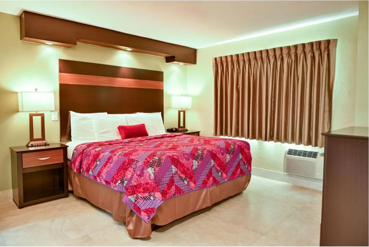 Bedroom, Bed in Oceans Beach Resort & Suites