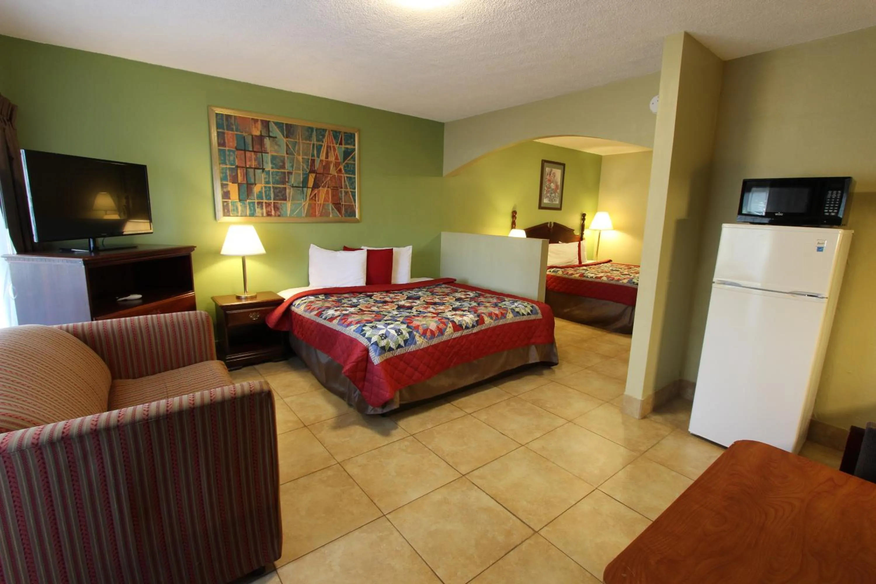 Bedroom, Bed in Oceans Beach Resort & Suites