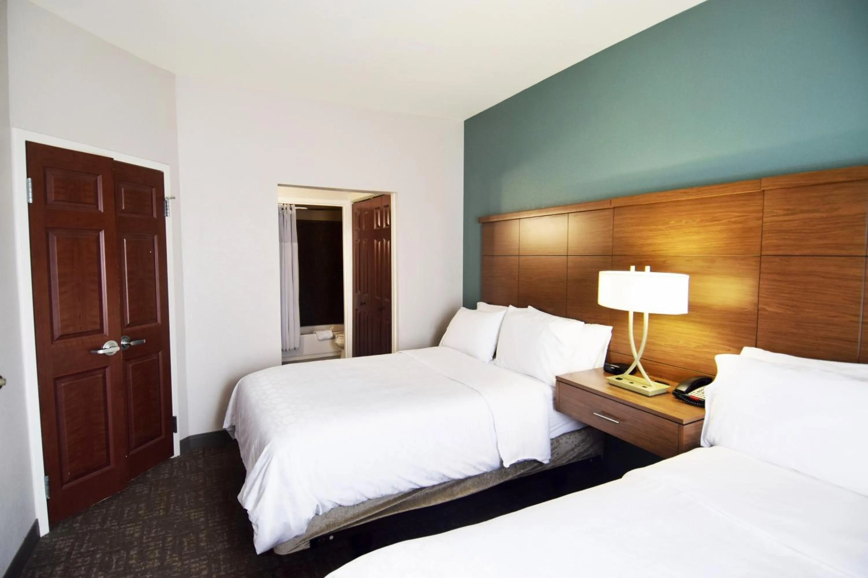 Bed in Staybridge Suites Hot Springs by IHG