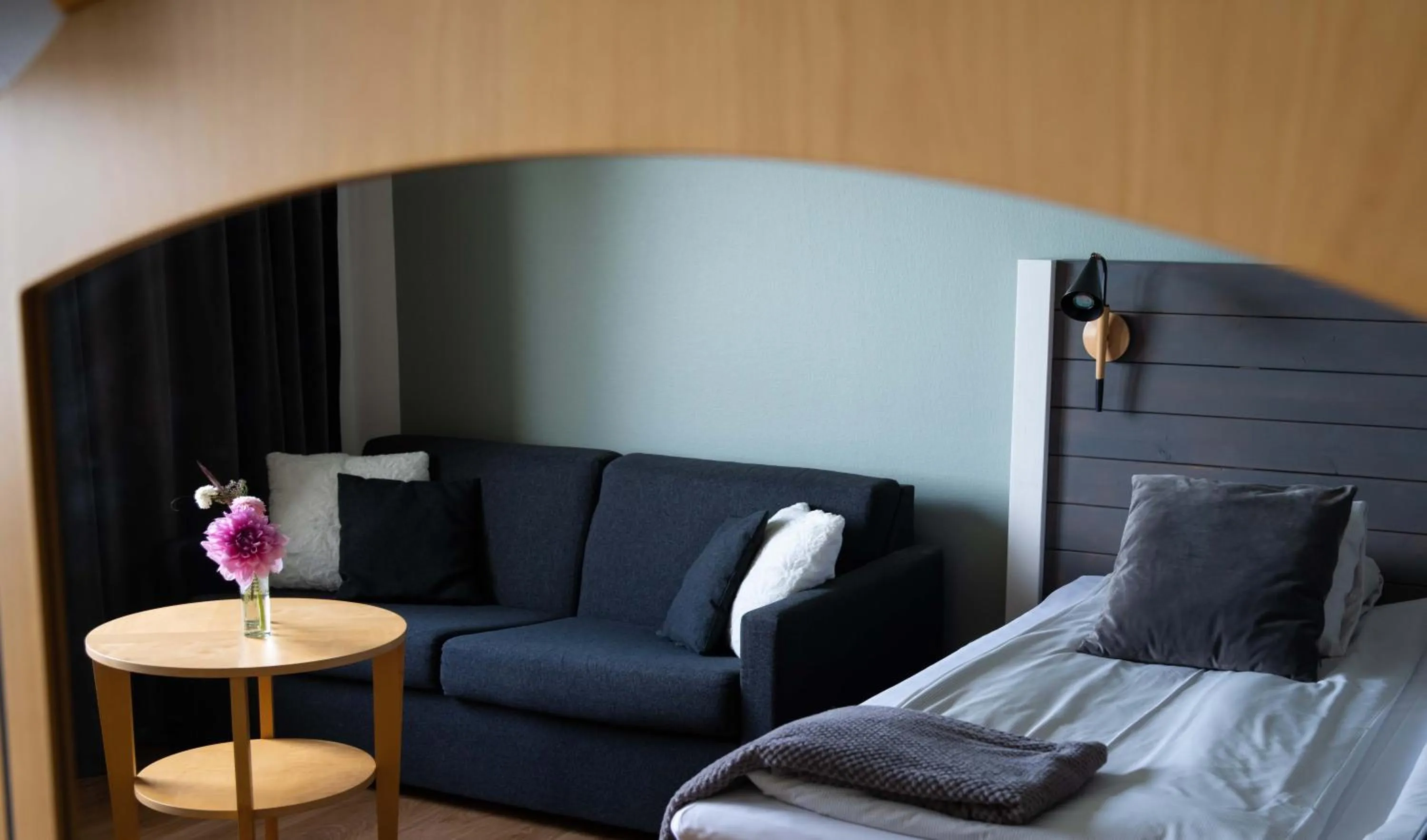 Seating area, Bed in Hotel Ullinge