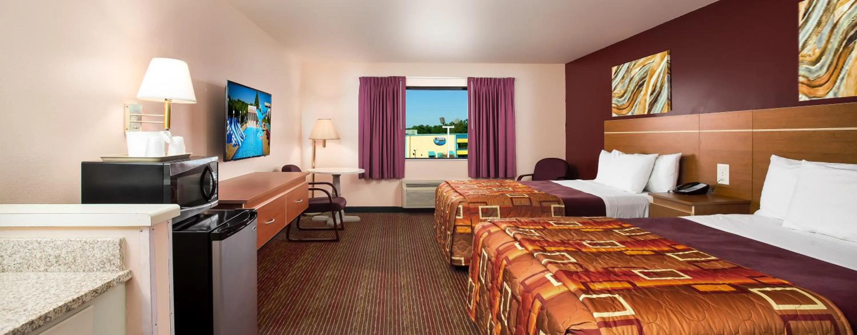 Bed in Grand Marquis Waterpark Hotel & Suites