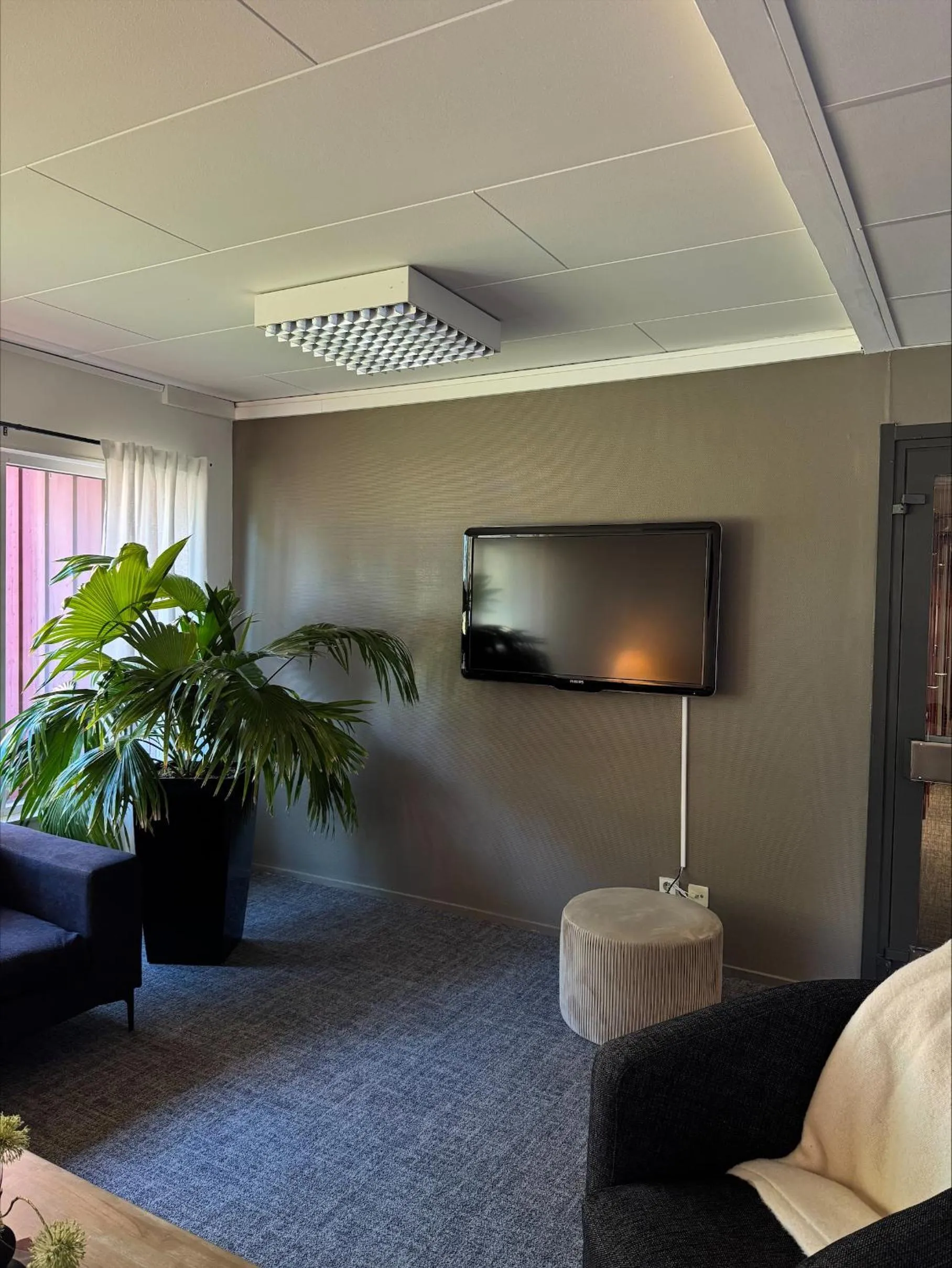 Communal lounge/ TV room in First Camp Moraparken Hotel