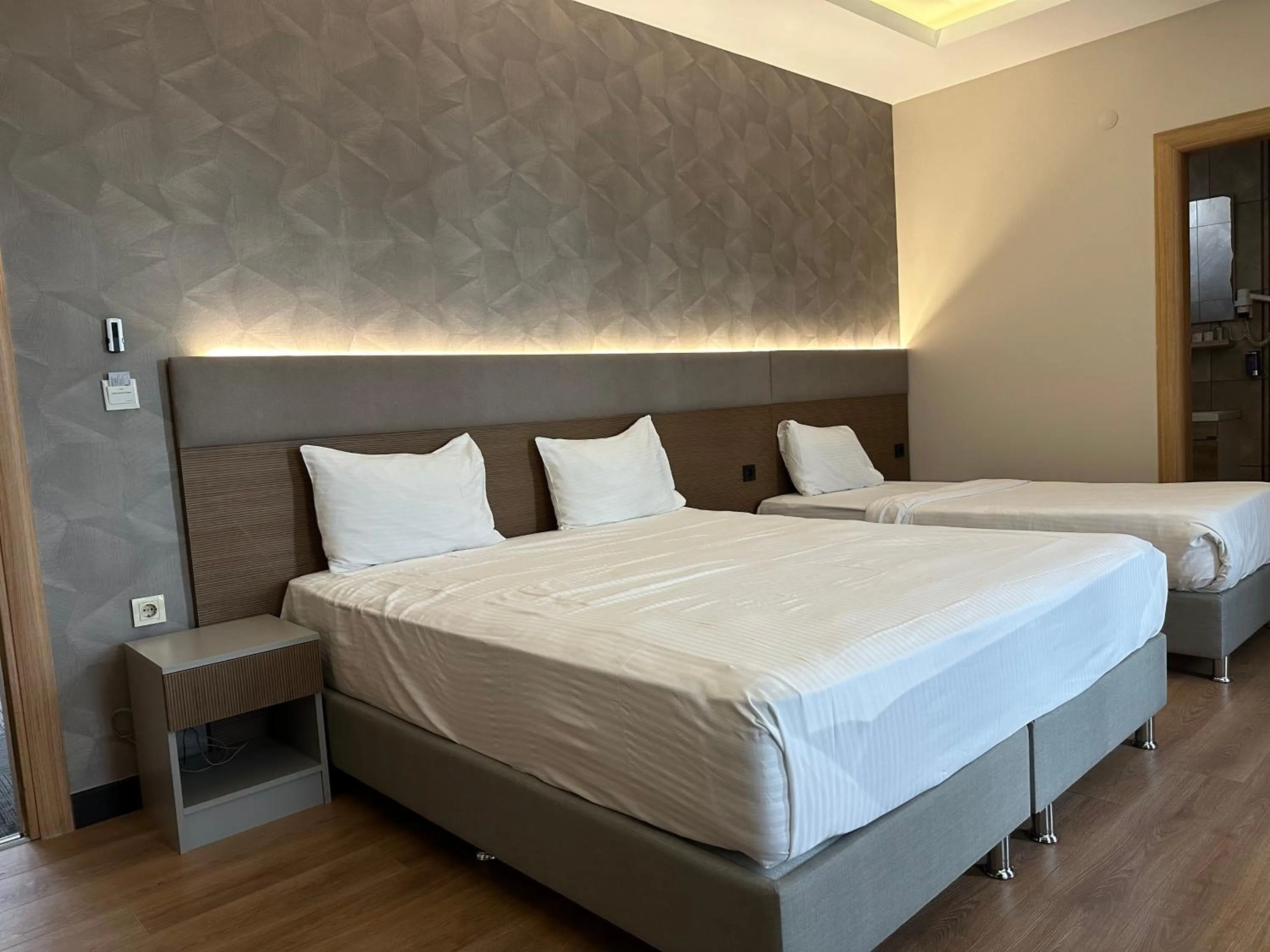 Photo of the whole room, Bed in Niconya Port Suite&Hotel