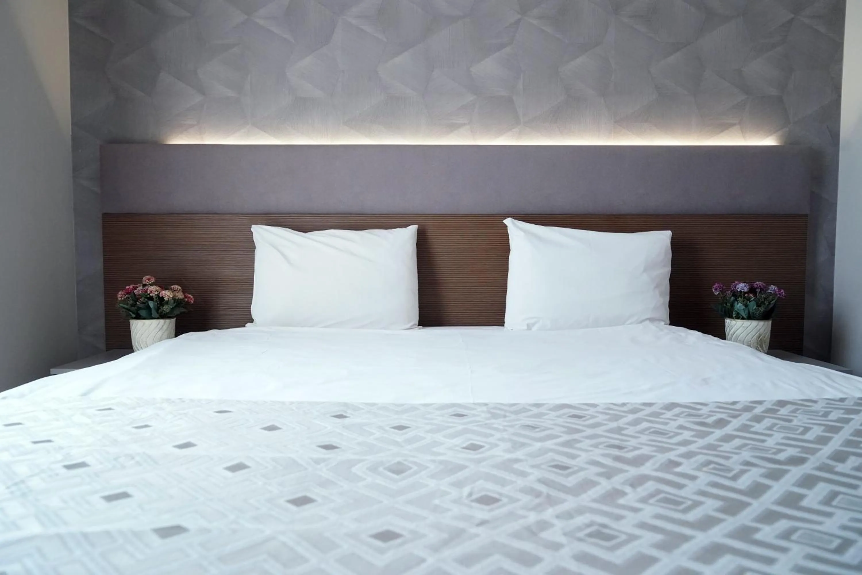 Bed in Niconya Port Suite&Hotel