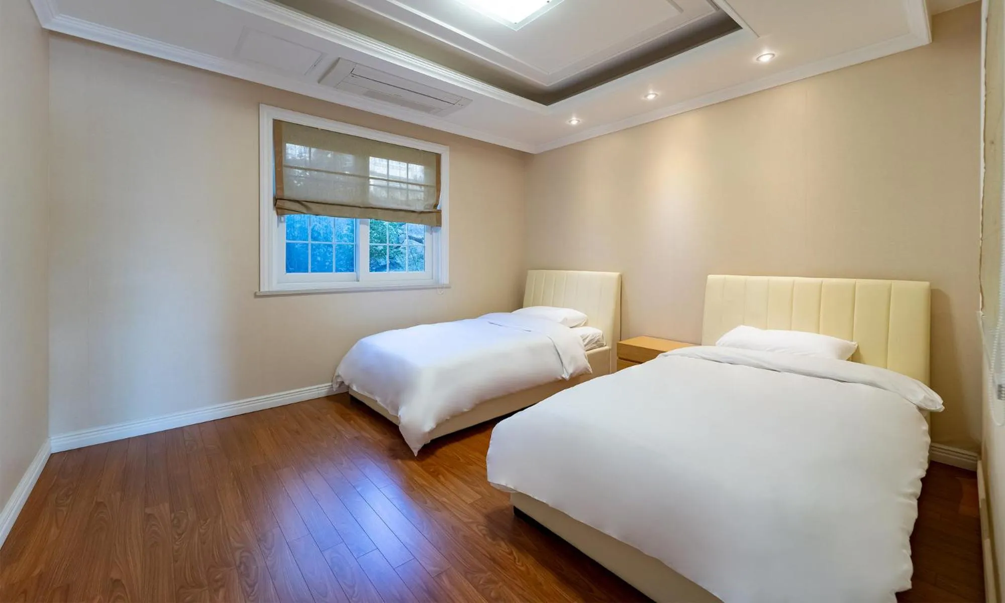 Bed in Kylin Villa resort Jeju