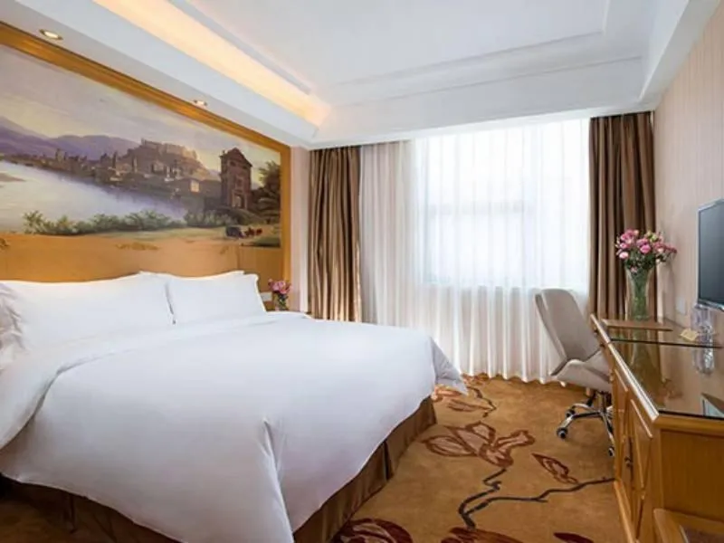 Bed in Vienna Hotel Longchuan