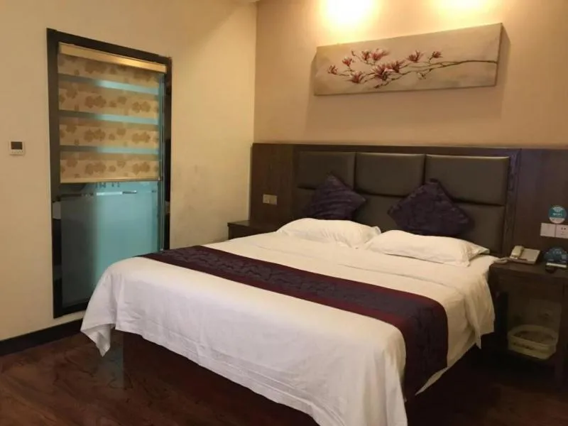 Bed in GreenTree Inn JiangSu NanTong HaiMen Shanghe Plaza Express Hotel