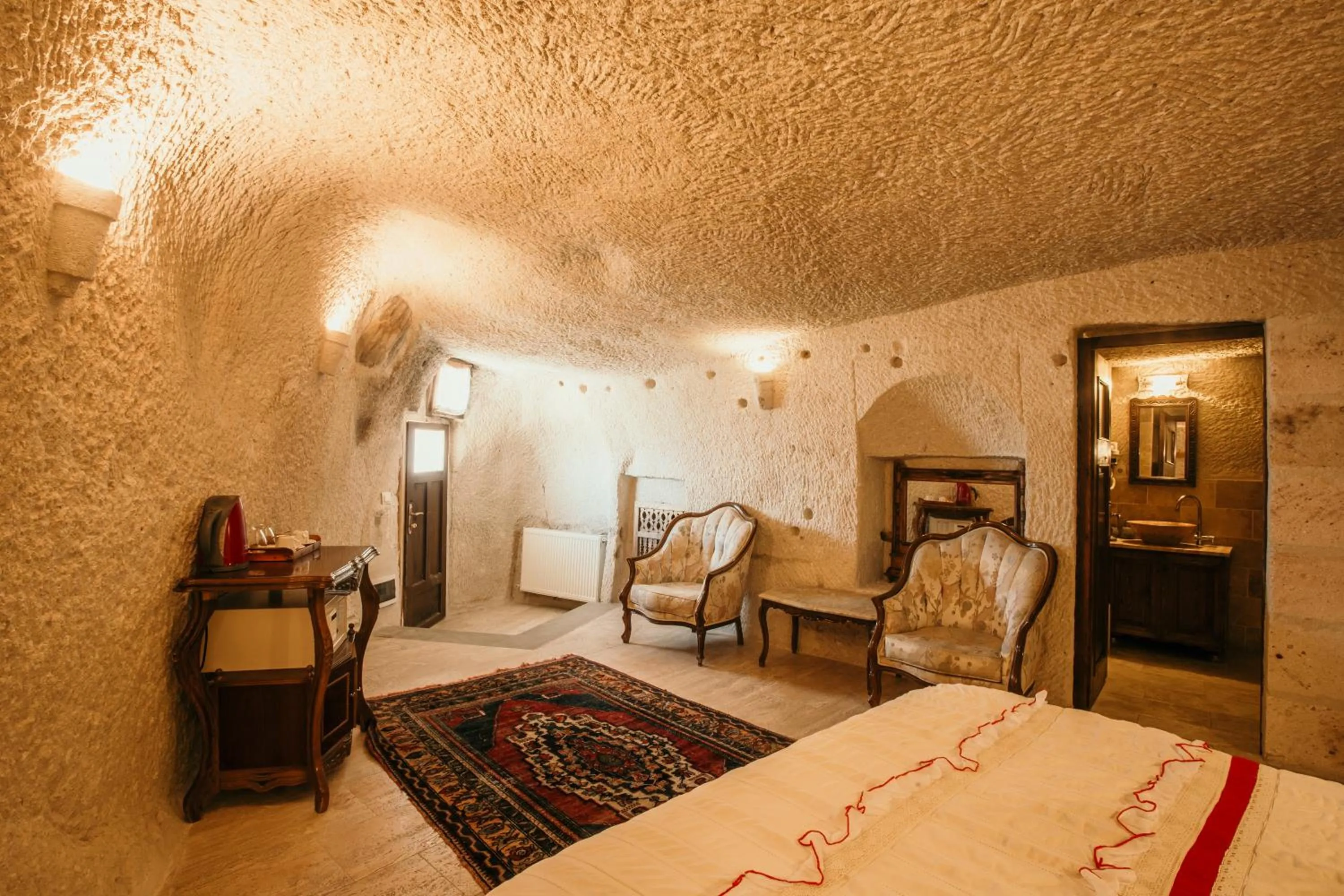 Bed in Village Cave House Hotel