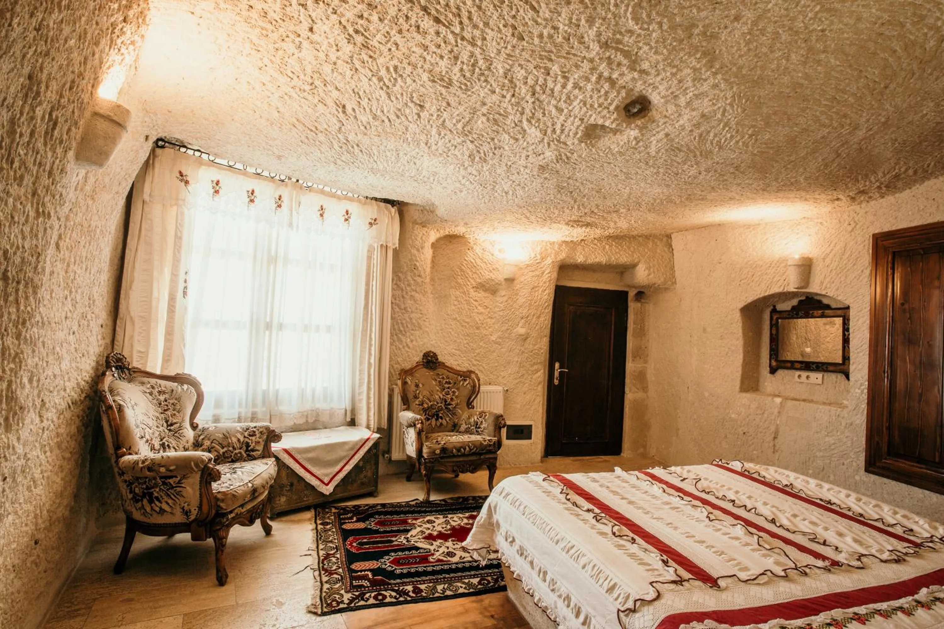 Bed in Village Cave House Hotel