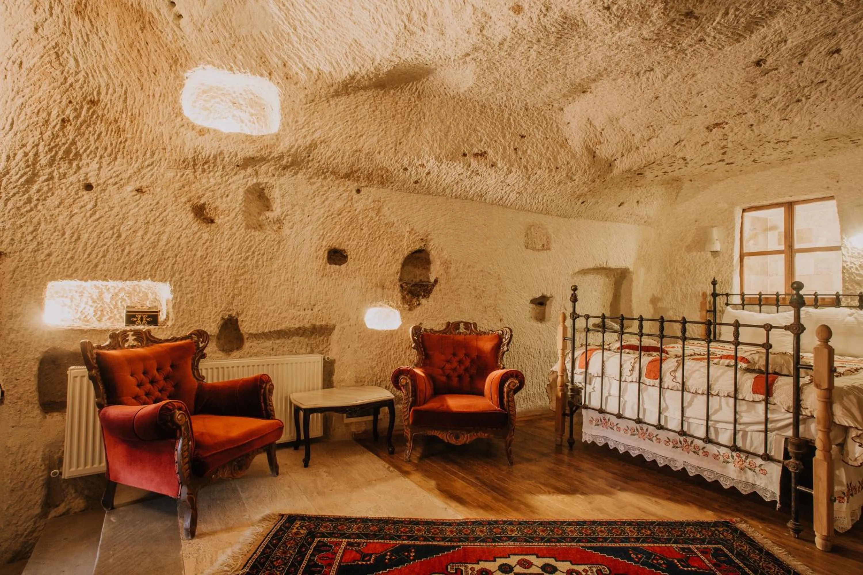 Bed in Village Cave House Hotel