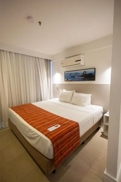 air conditioner, Bed in Ramada by Wyndham Macae Hotel & Suites