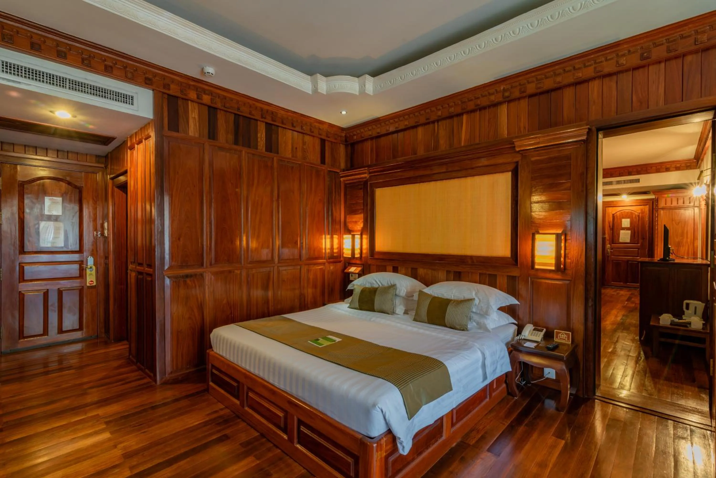 Bed in Empress Angkor Resort & Spa