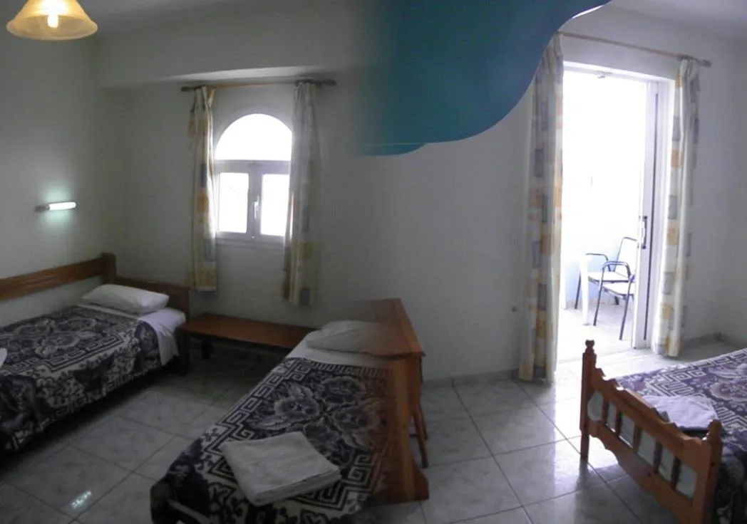 Bed in Vossos Hotel Apartments