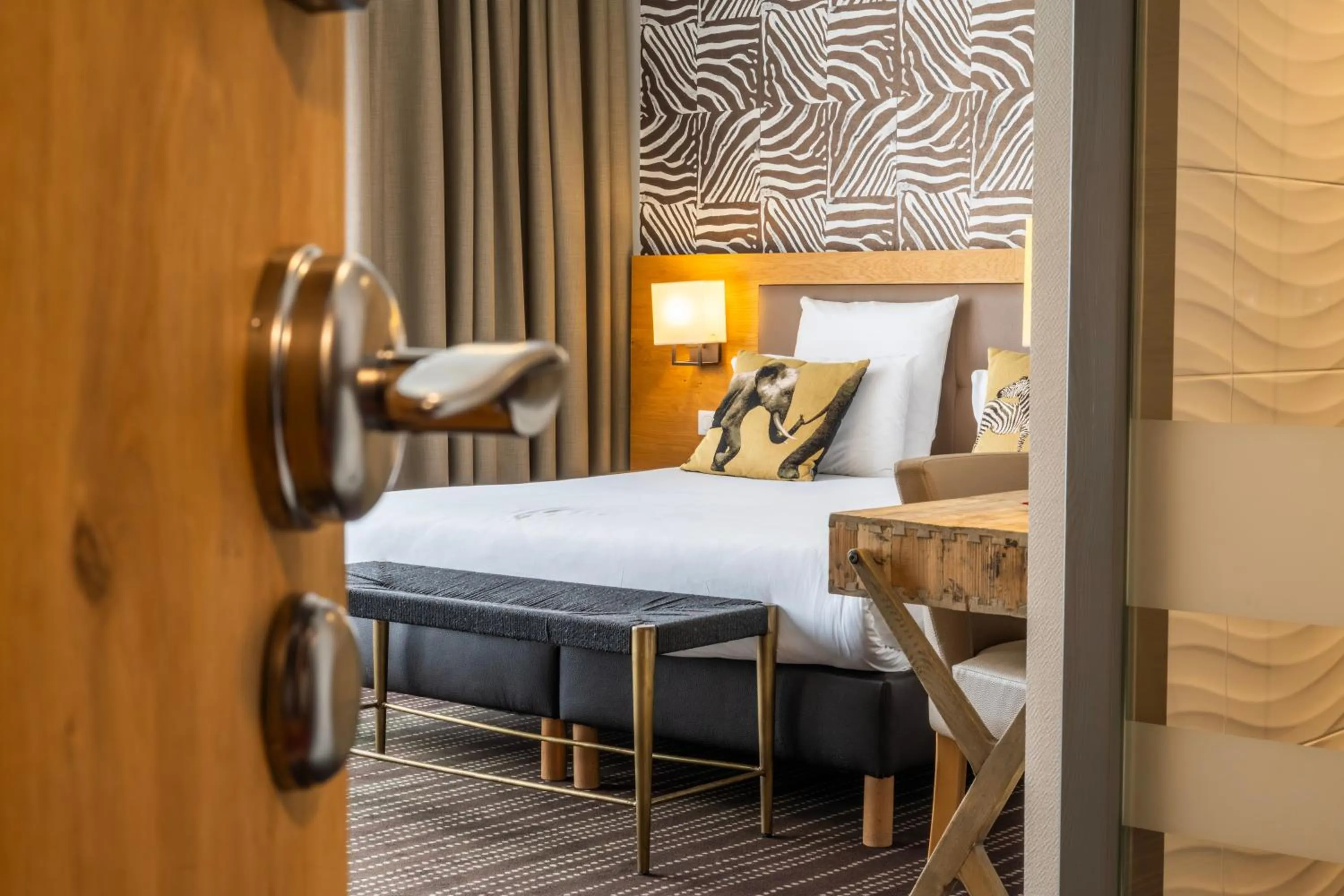 Decorative detail, Bed in Le Lodge Brit Hotel Strasbourg Zenith