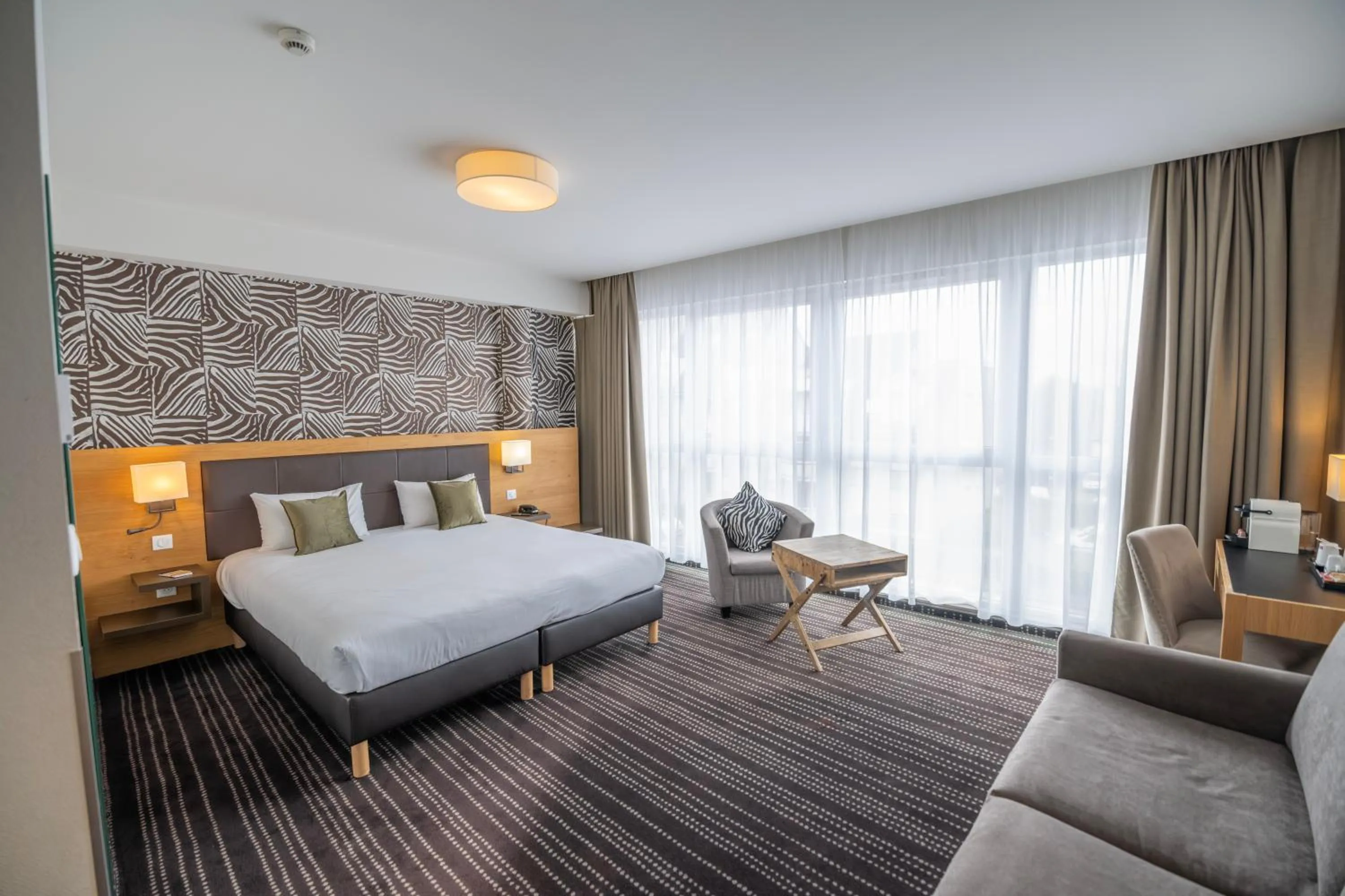 Bed in Le Lodge Brit Hotel Strasbourg Zenith