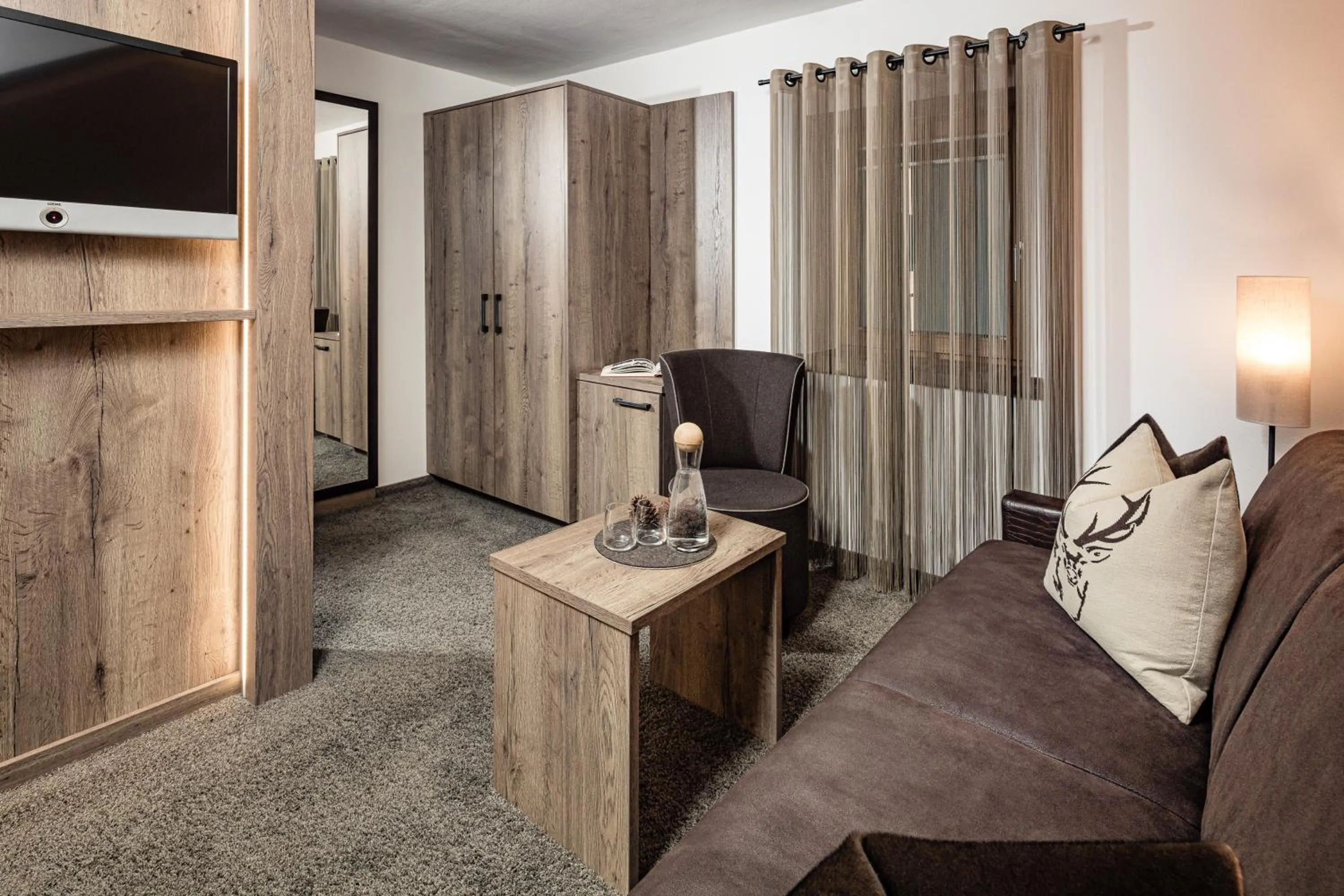 Living room in Boutique & Fashion Hotel Maciaconi - Gardenahotels