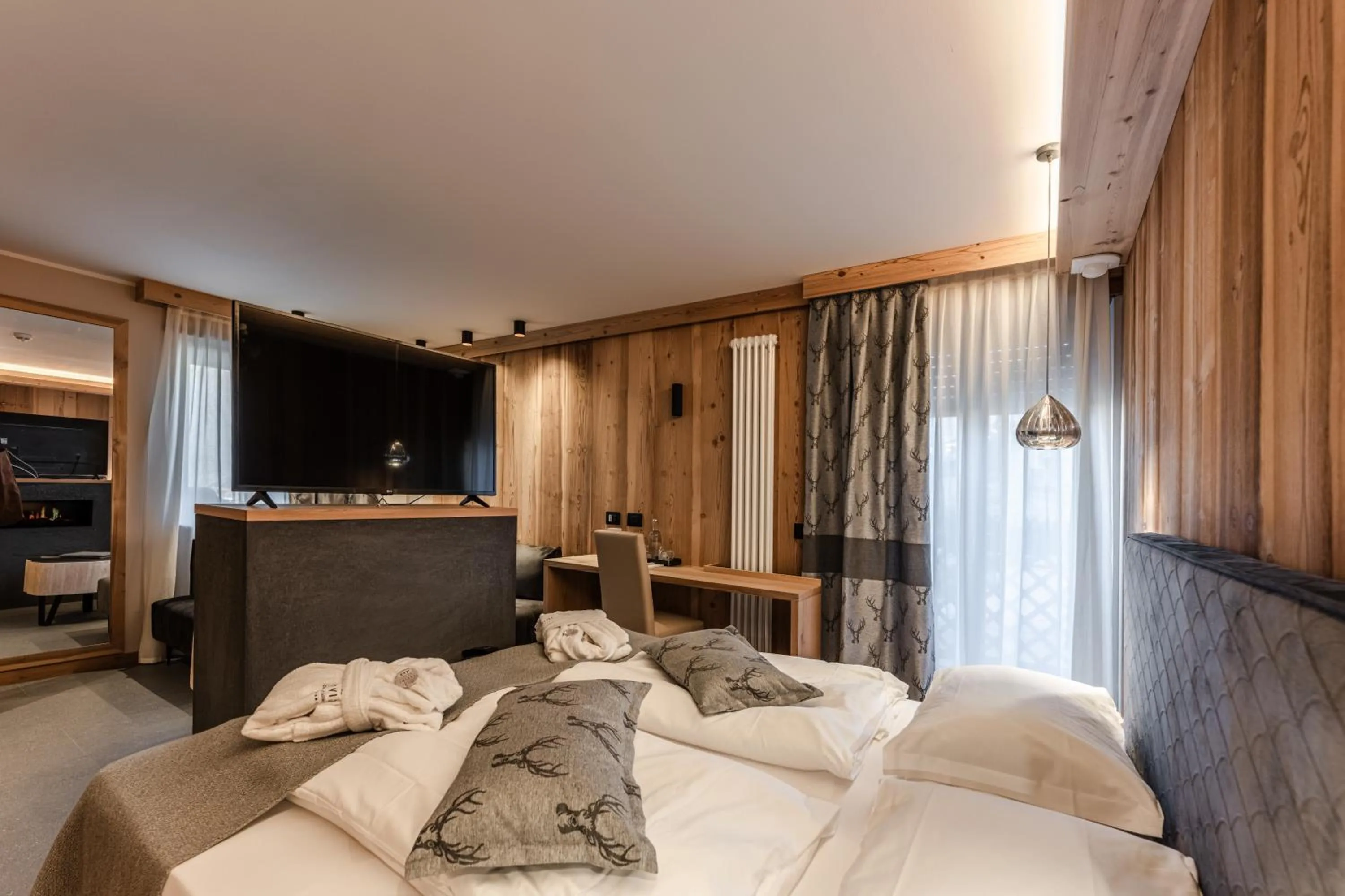 Bedroom, Bed in Tevini Dolomites Charming Hotel