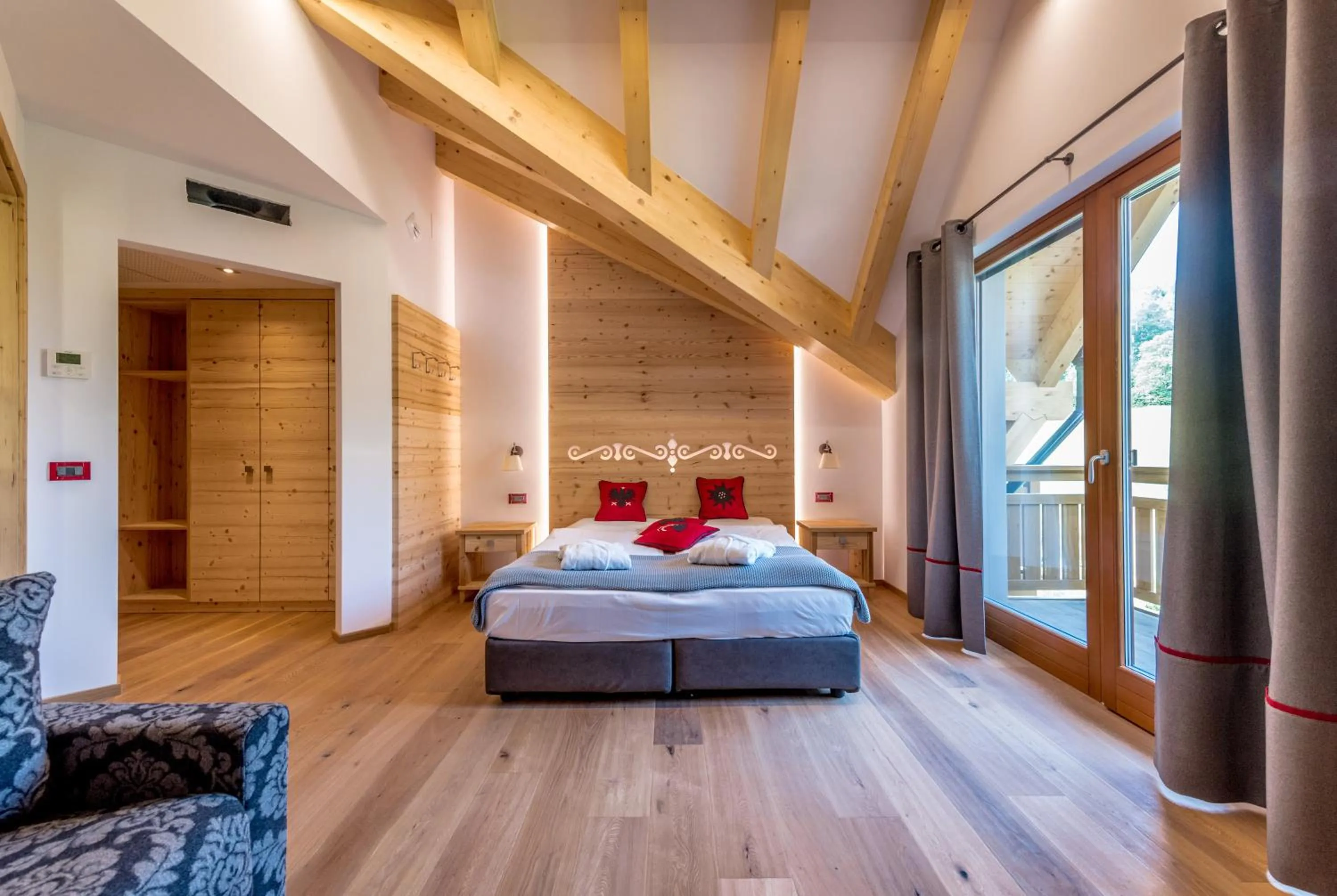 Bedroom, Bed in Tevini Dolomites Charming Hotel