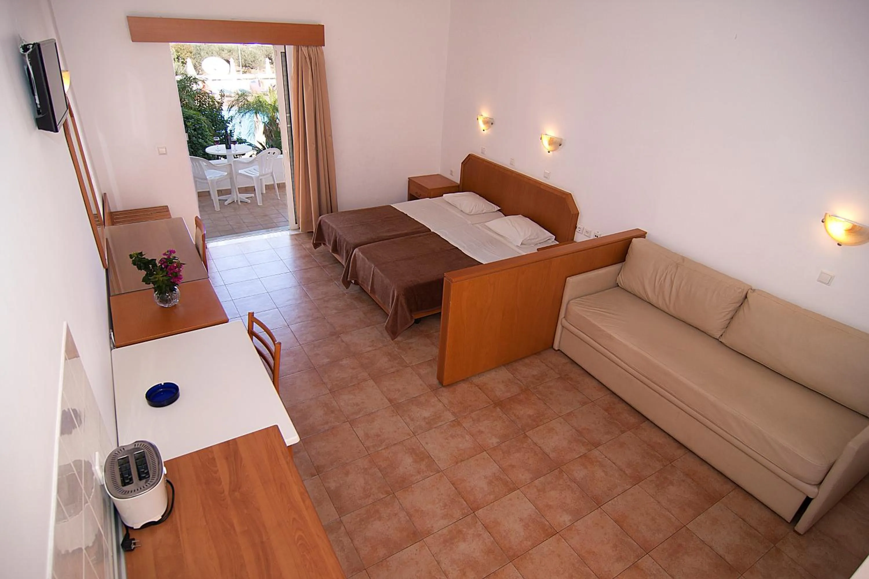 Bed in Lambis Studios & Apartments