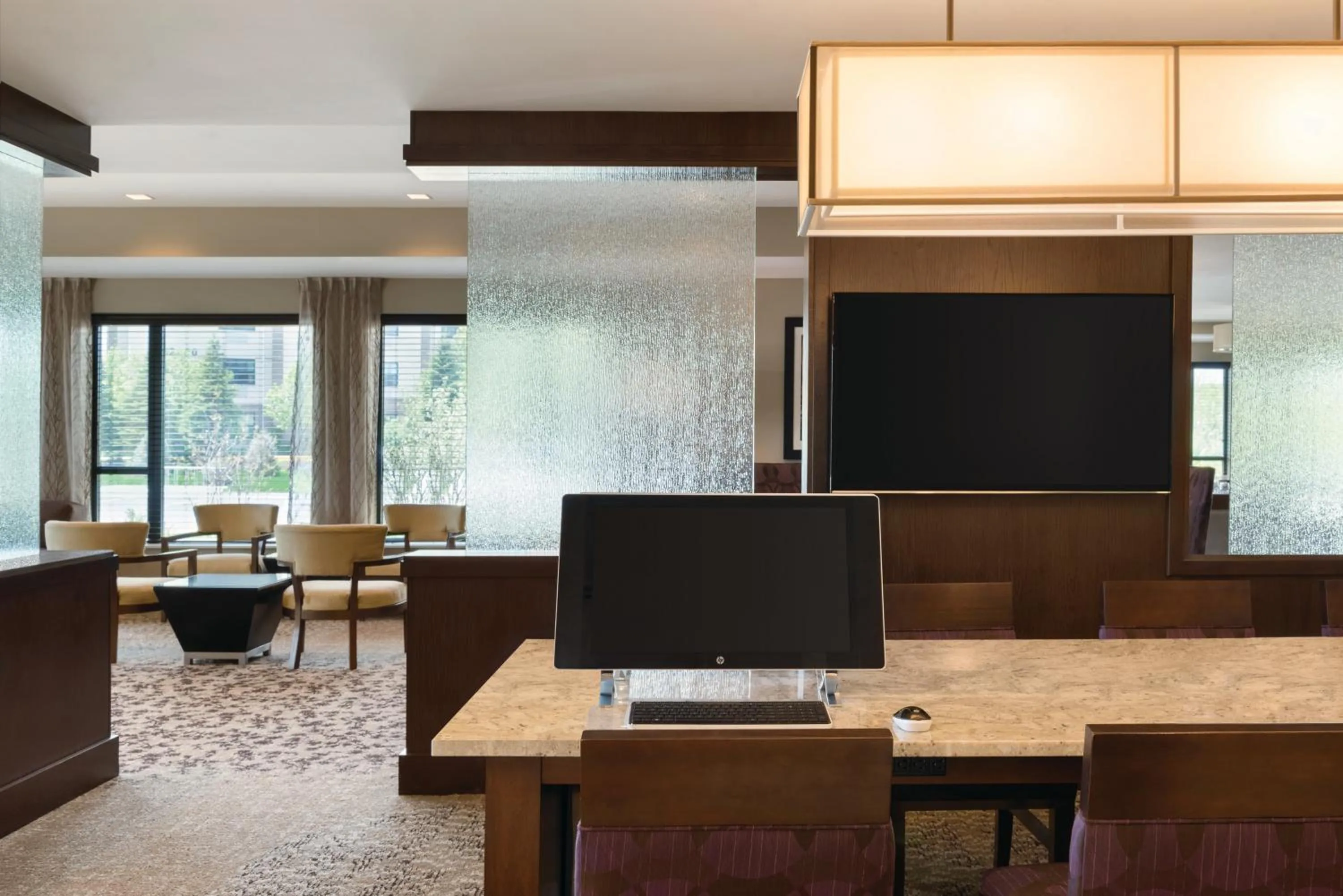 Communal lounge/ TV room in Holiday Inn Chicago Schaumburg by IHG