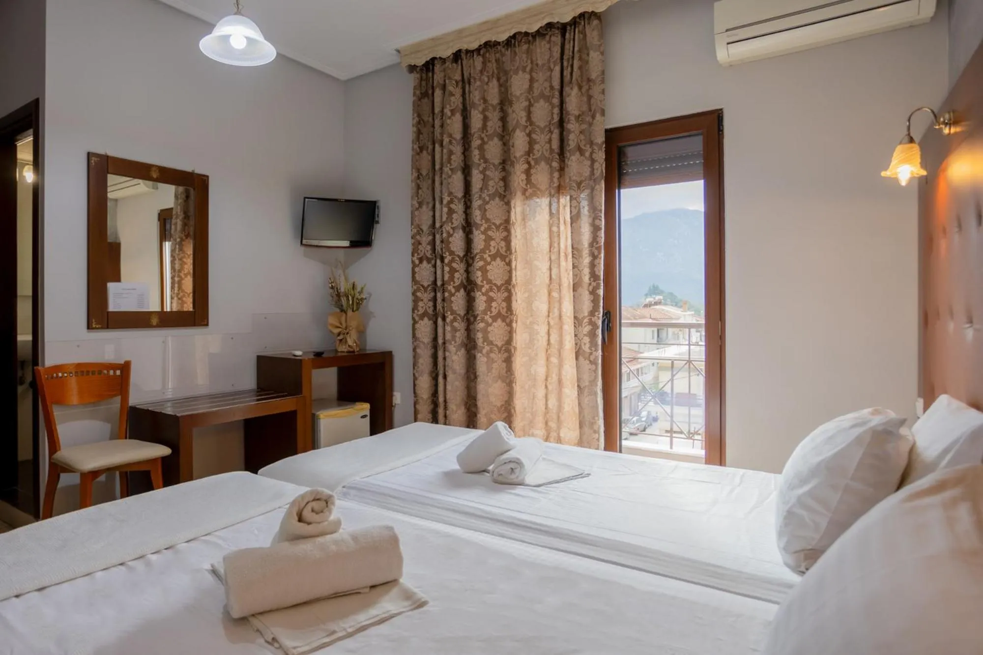 Bed in Toti Boutique Rooms