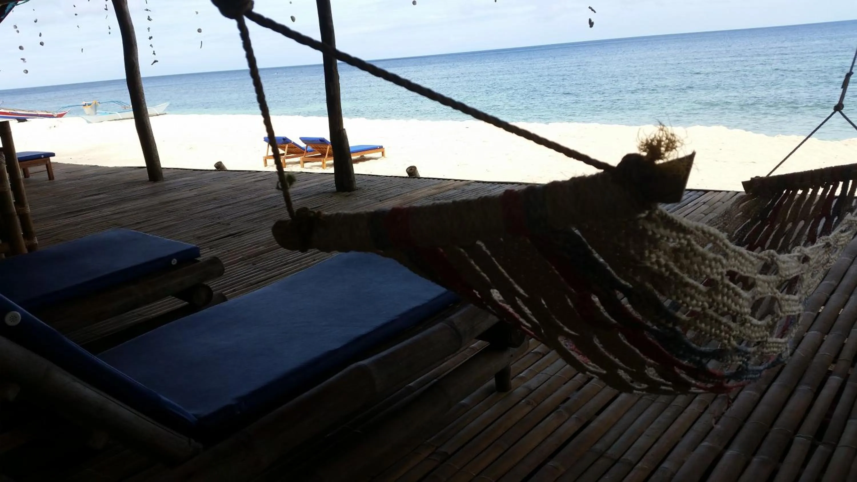 Seating area in White Beach Front and Cottages