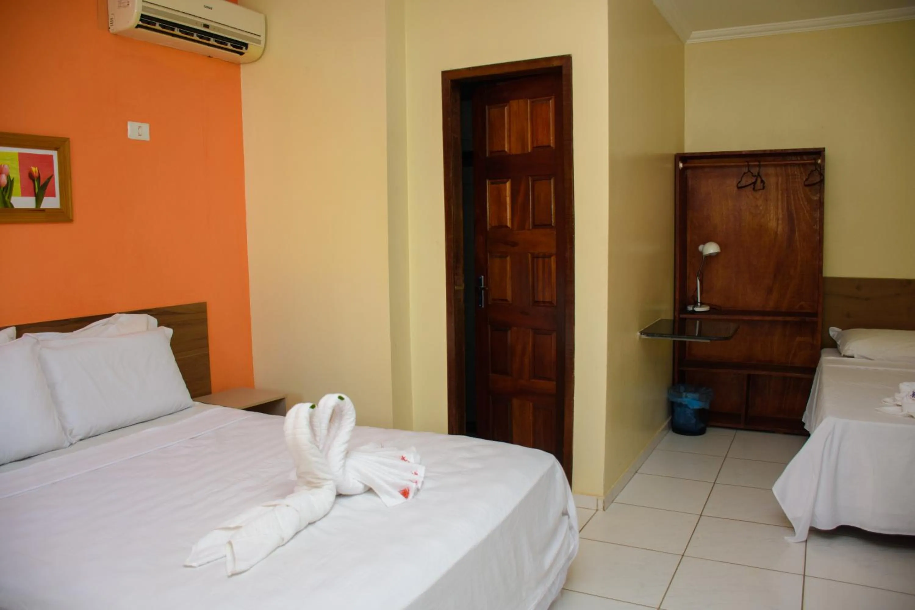 Bed in Pousada Velosmar