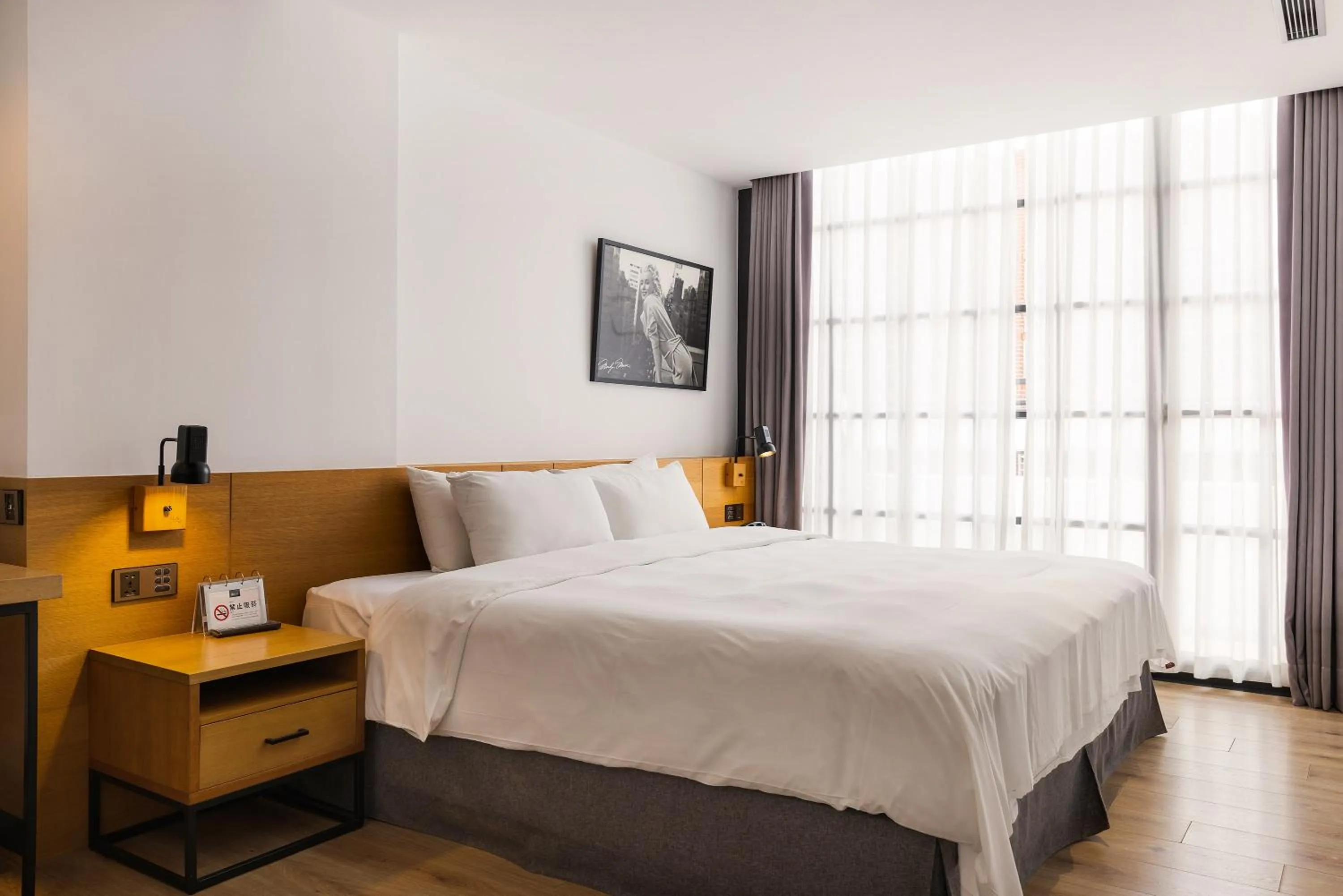 Bed in BlueSky Hotel