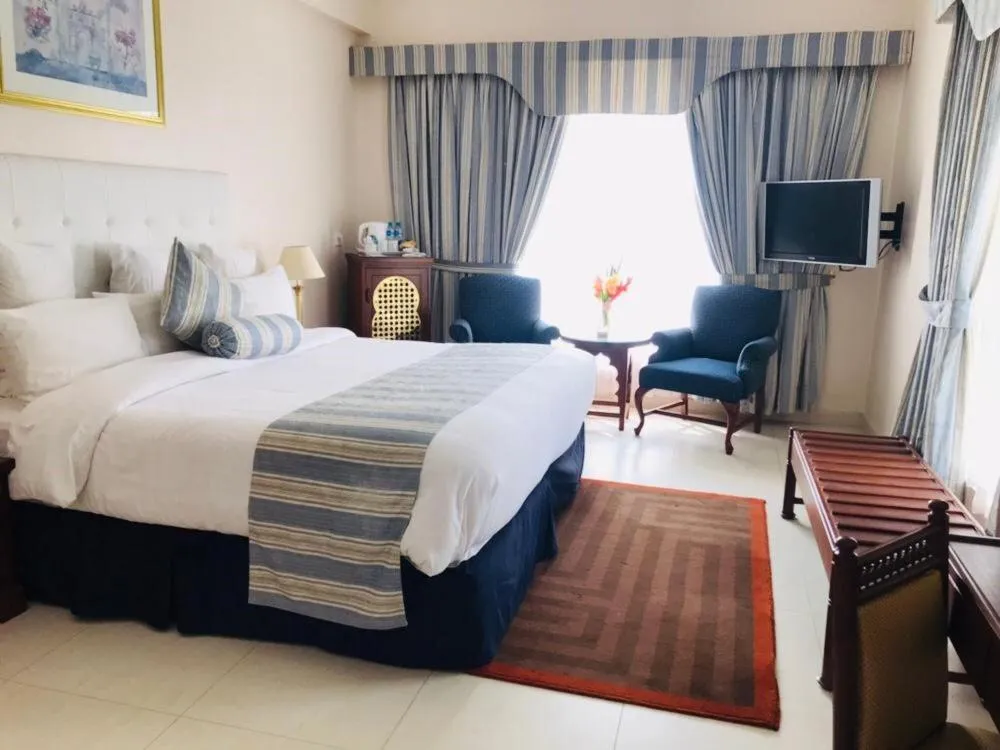Seating area, Bed in Beach Luxury Hotel