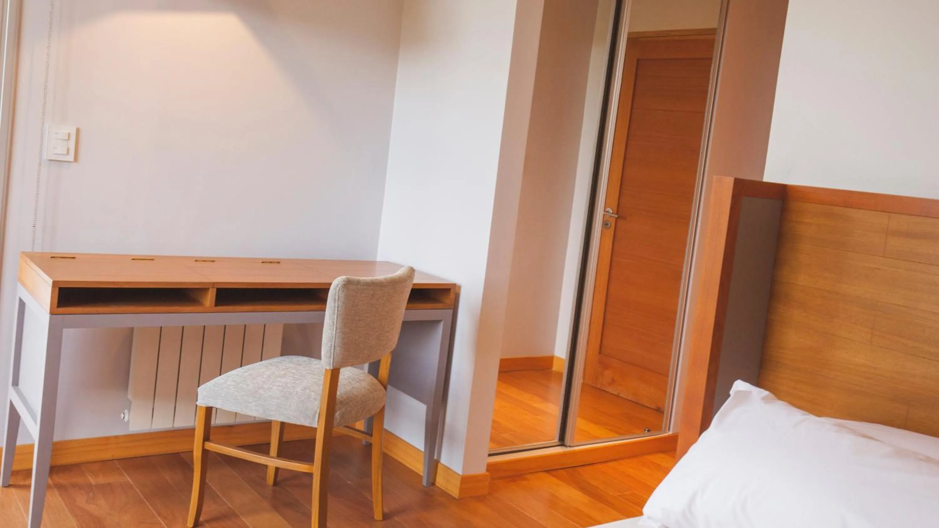 Seating area, Bed in Amalinas Hotel