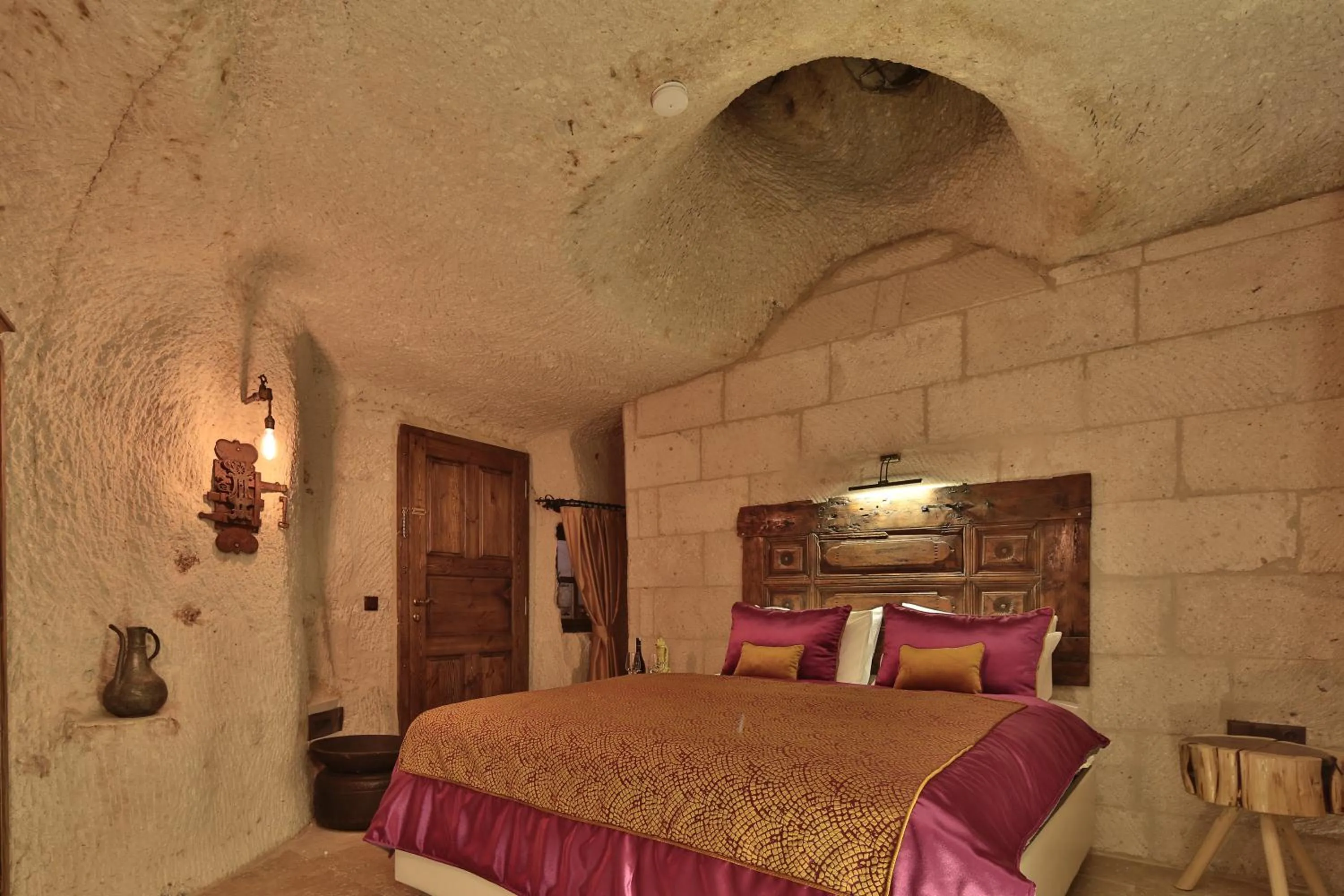 Bed in The Owl Cave Hotel