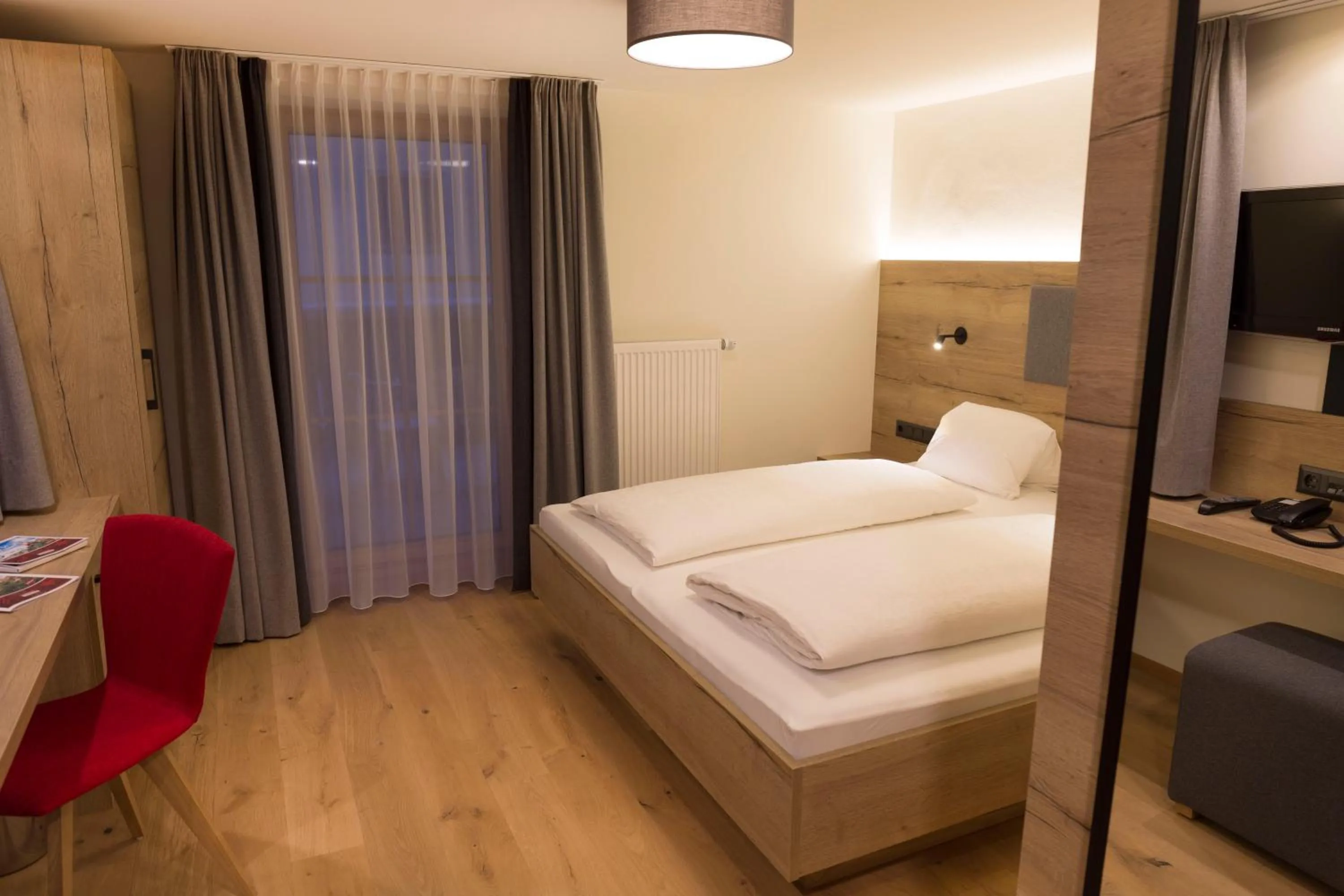 Living room, Bed in Hotel Rosner