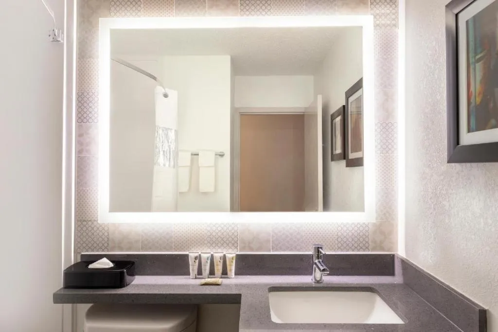 Shower in Country Inn & Suites by Radisson, North Little Rock, AR