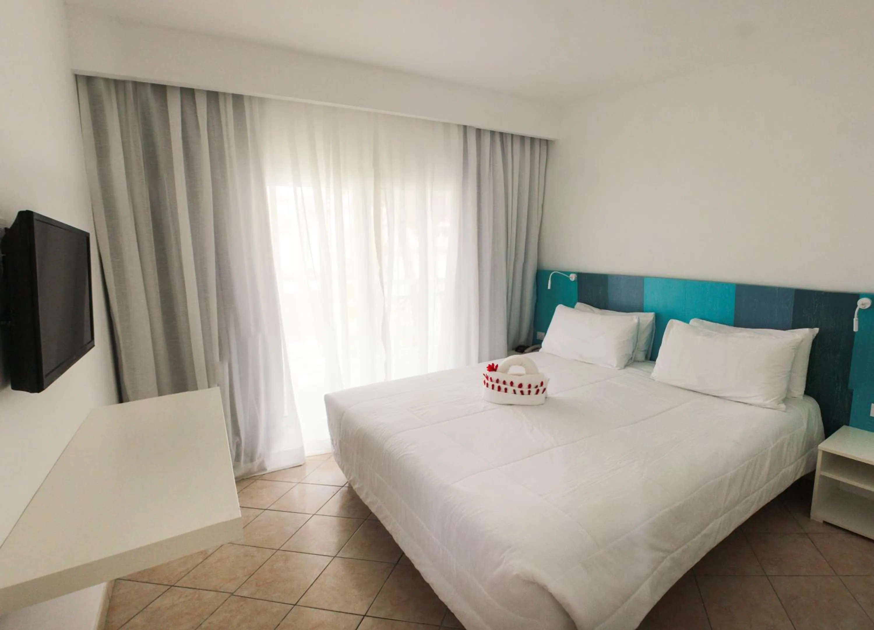 Bed in Viva Tangerine by Wyndham, A Trademark All Inclusive