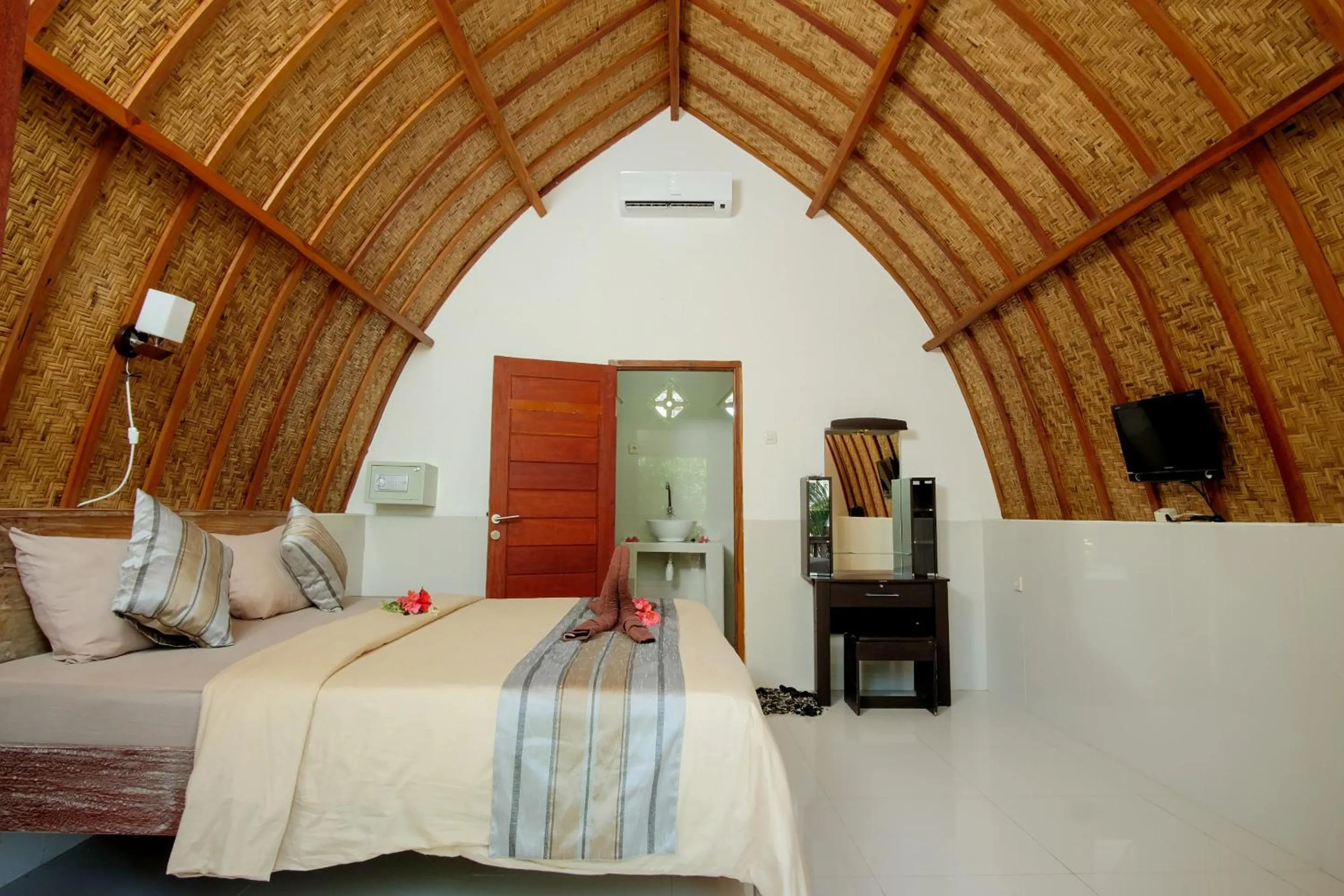 Bed in Warna Beach Hotel