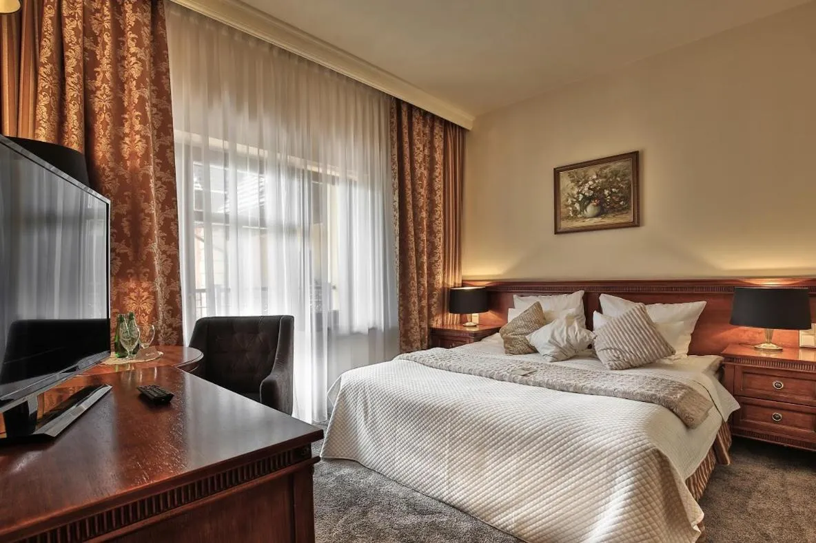 Bed in Grand Hotel Stamary