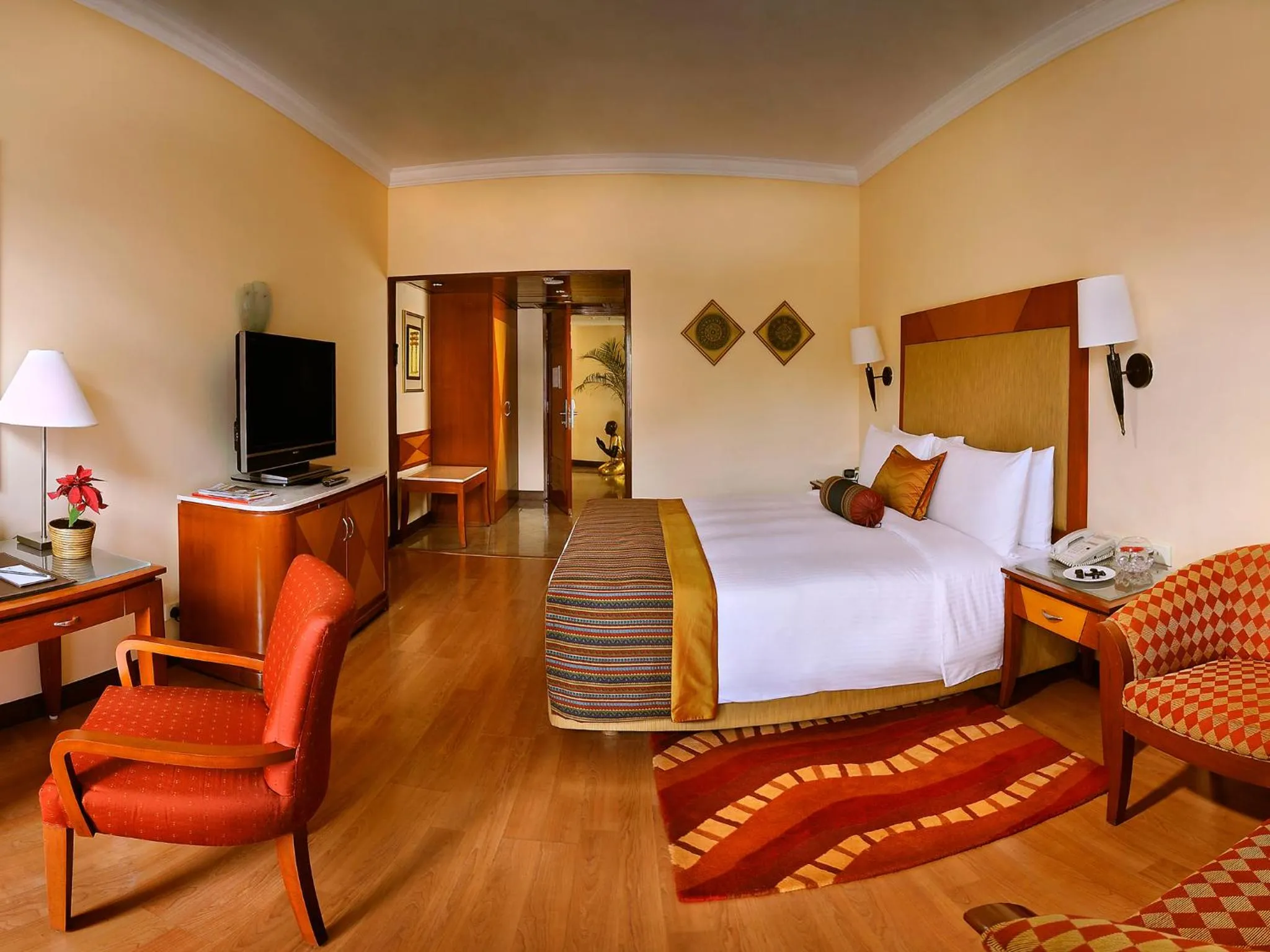 Photo of the whole room, Bed in The Lalit Ashok
