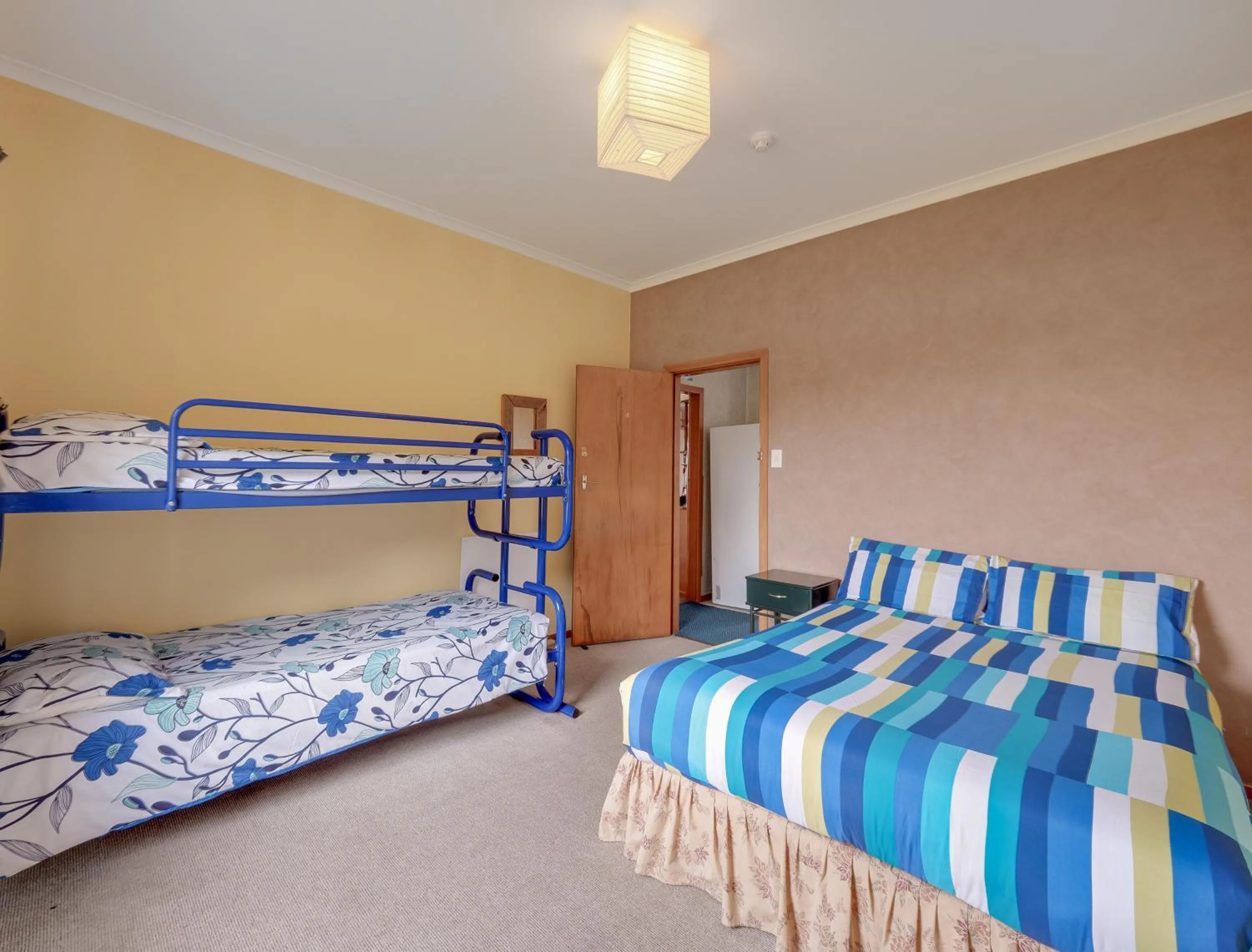 Photo of the whole room, Bed in Surat Bay Lodge, Motel and Backpackers