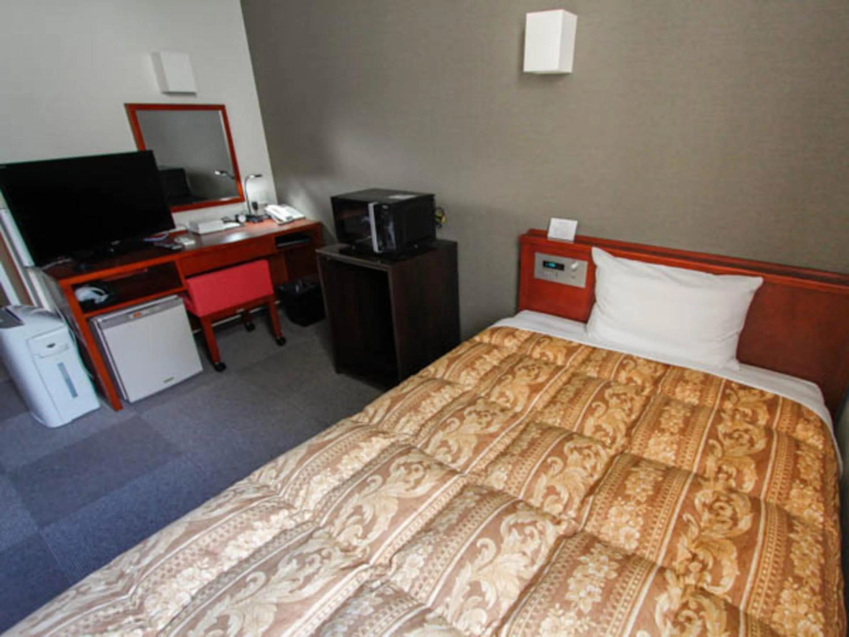Bed in HOTEL LiVEMAX BUDGET Hamamatsu-Ekimae