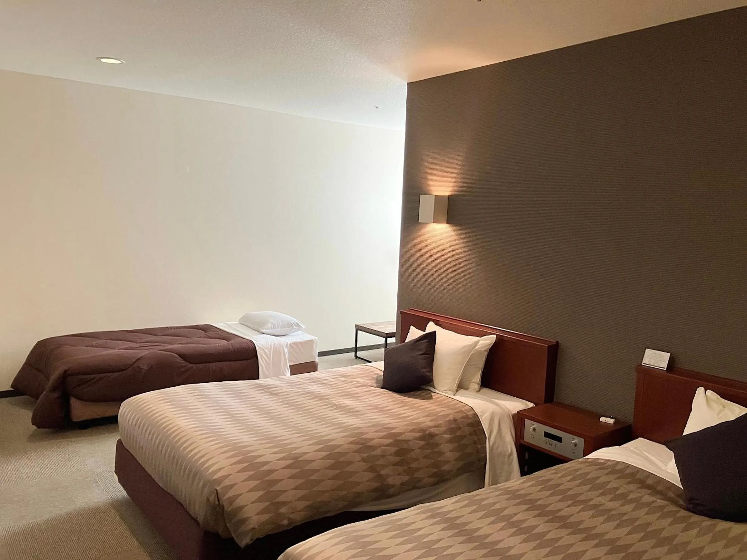 Bed in HOTEL LiVEMAX BUDGET Hamamatsu-Ekimae