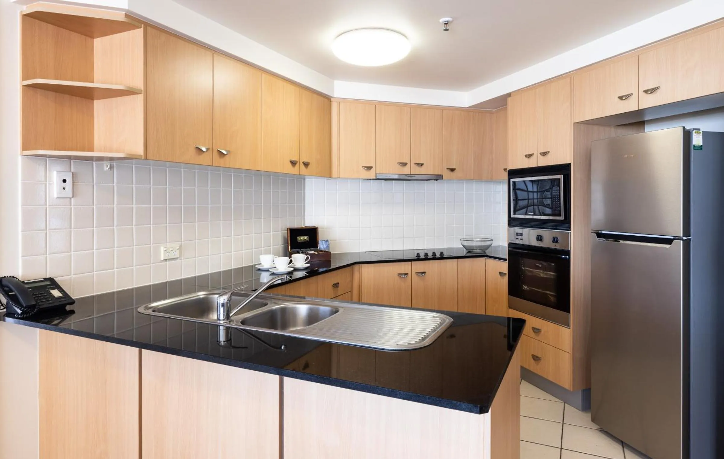 Kitchen or kitchenette in Bel Air on Broadbeach - Official