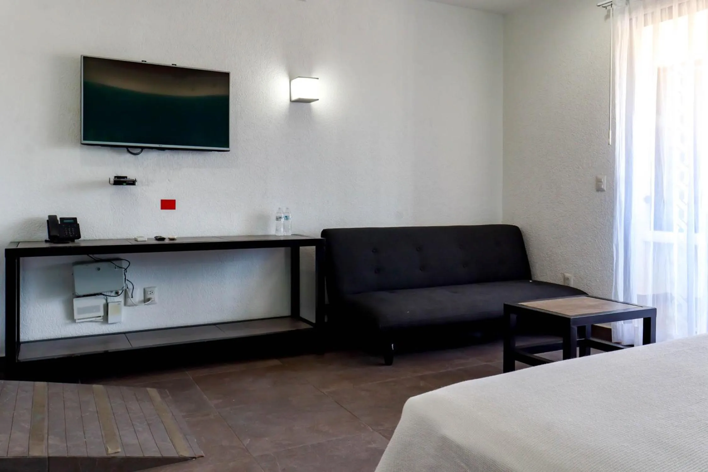 Seating area, Bed in Hotel MX portal maya