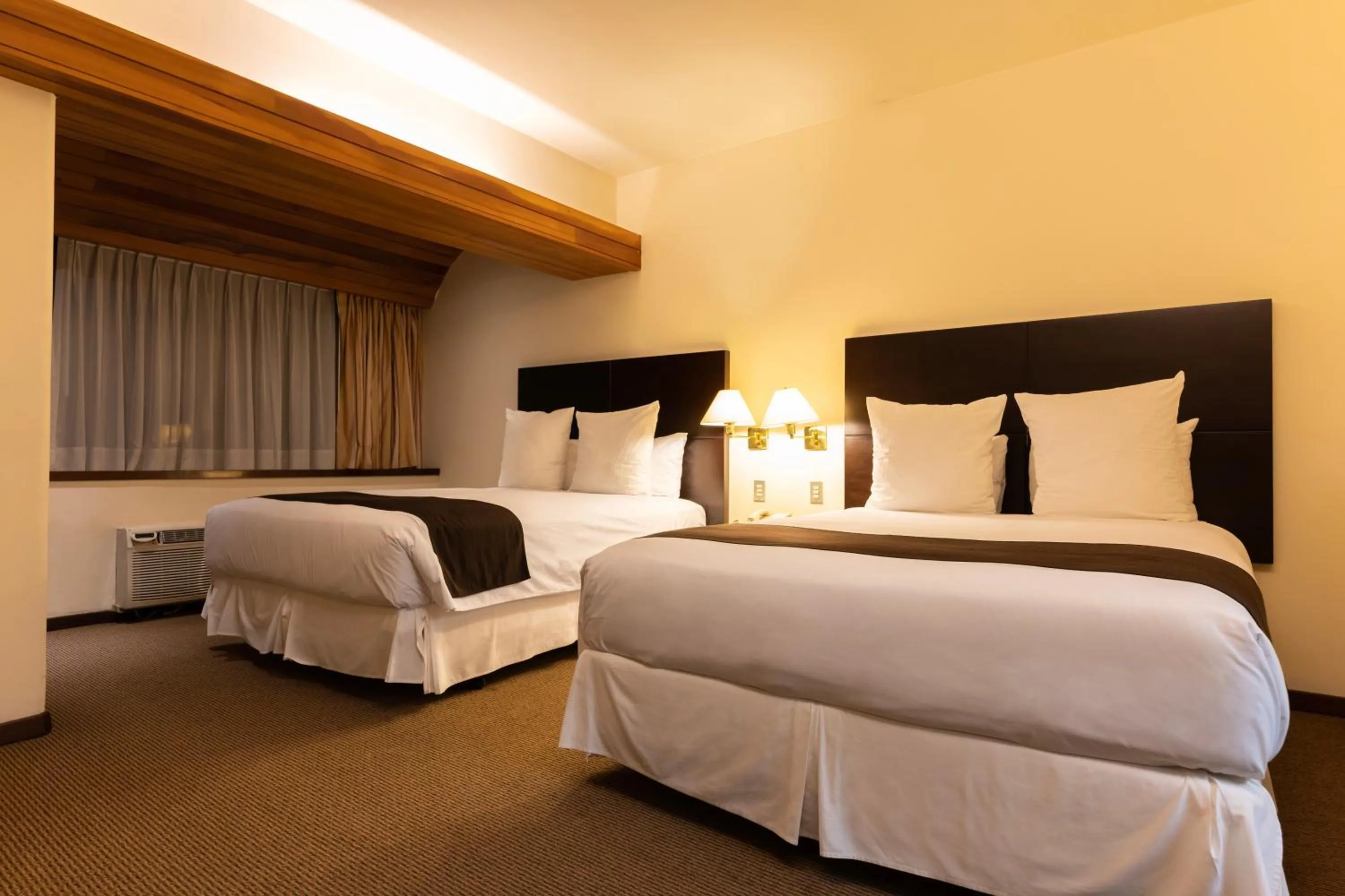 Bed in J&A Classic Hotel