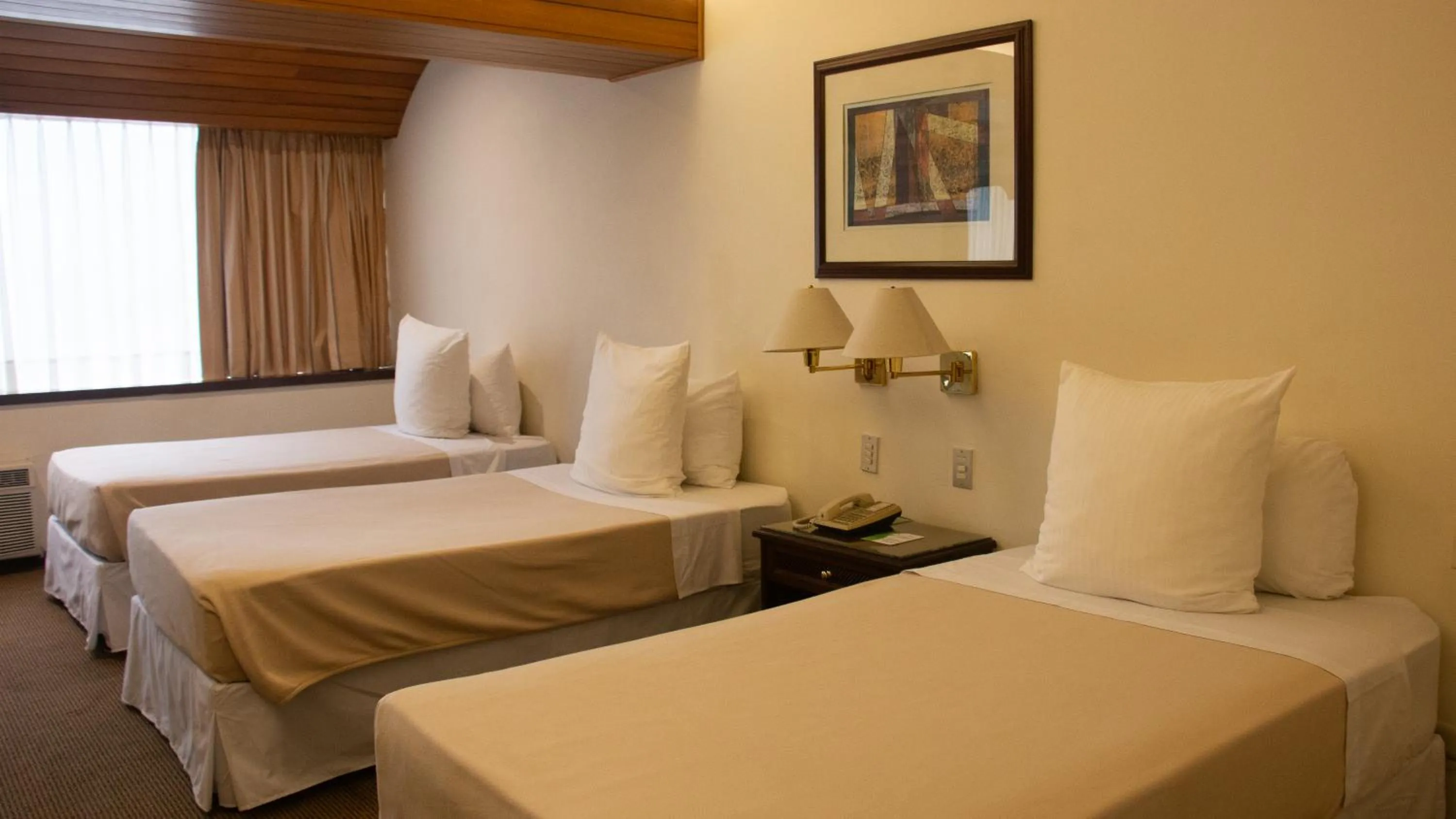 Bed in J&A Classic Hotel